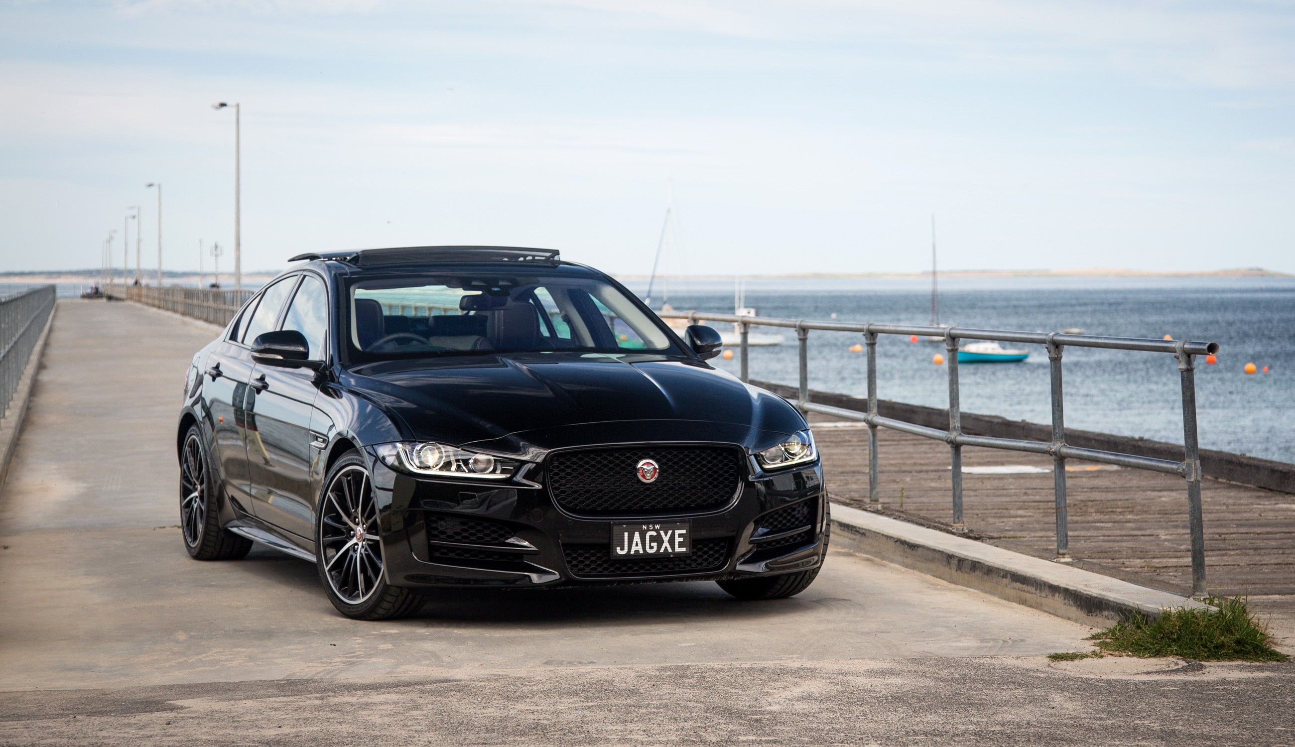 Black Jaguar XE 25t R-Sport on a Pier HD Wallpaper