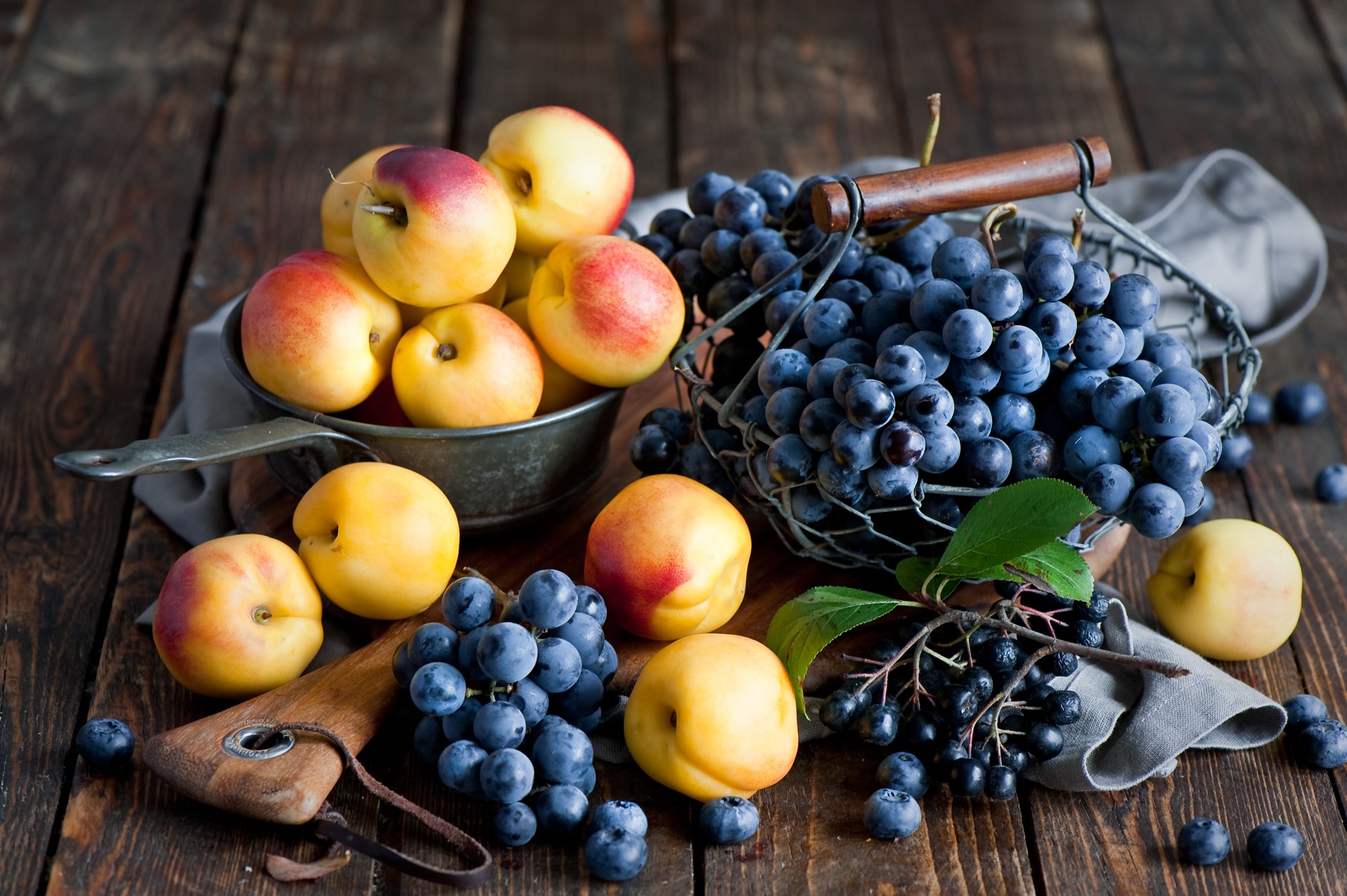 Still life of fruits: apricots, grapes, and blueberries HD Wallpaper