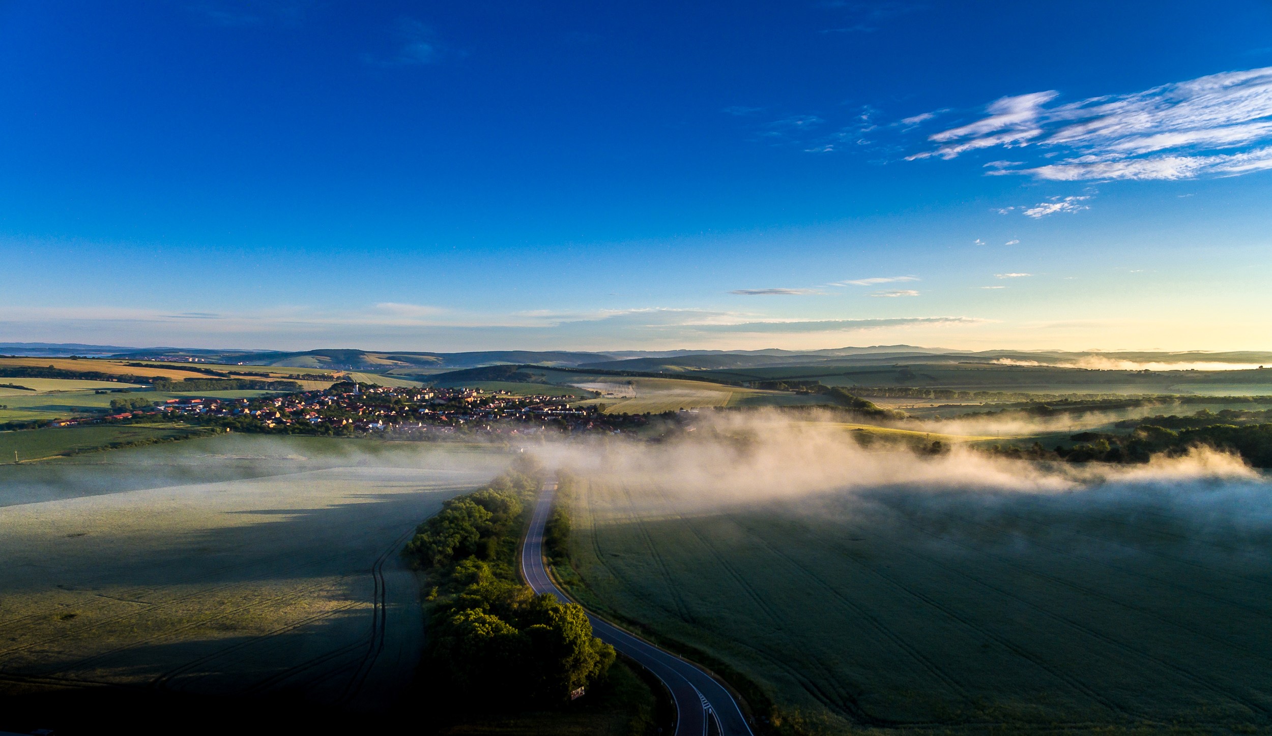 Aerial view of Sucha Loz, Czech Republic with fog and fields HD Wallpaper