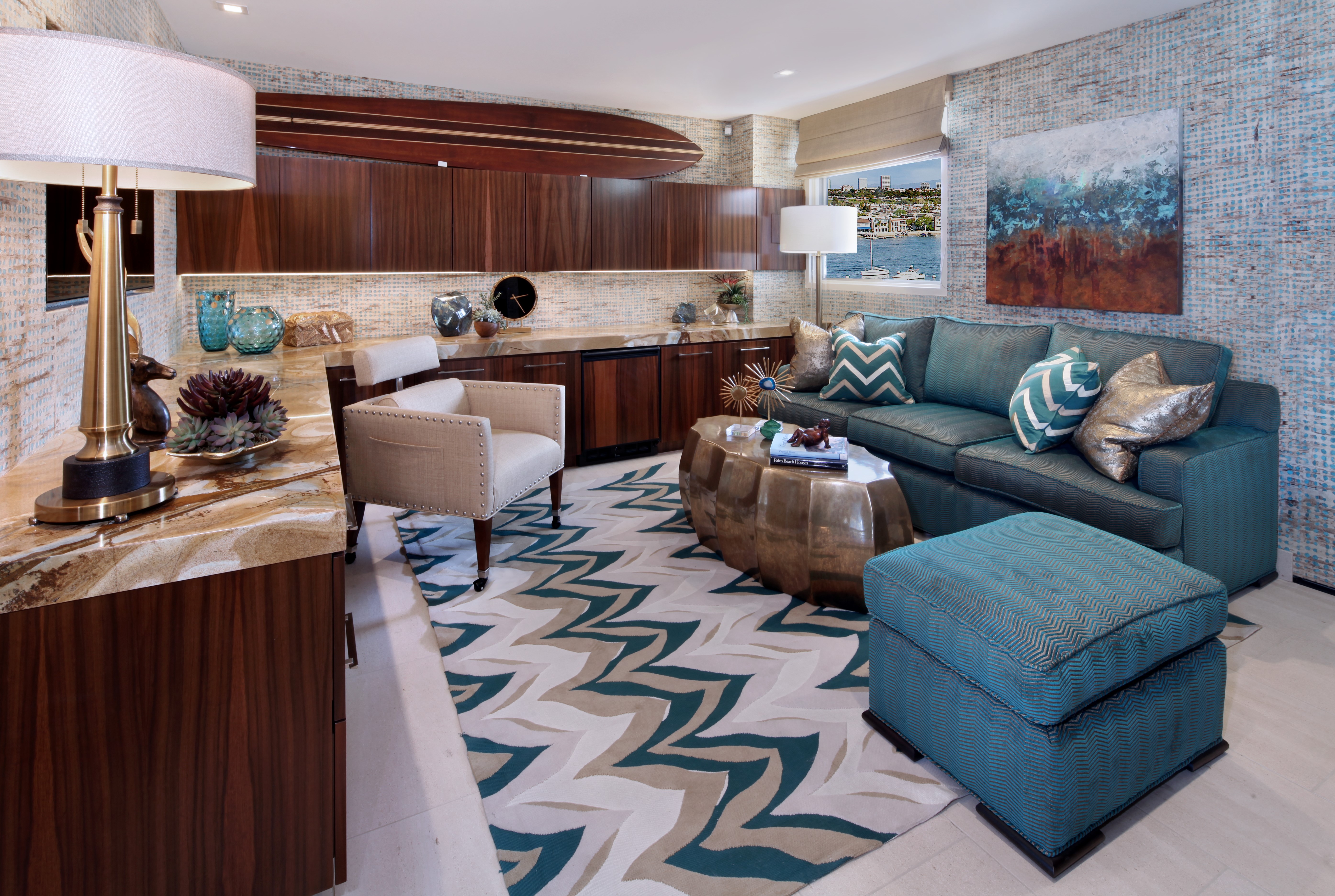 Living room with sofa, armchair, and surfboard decor HD Wallpaper