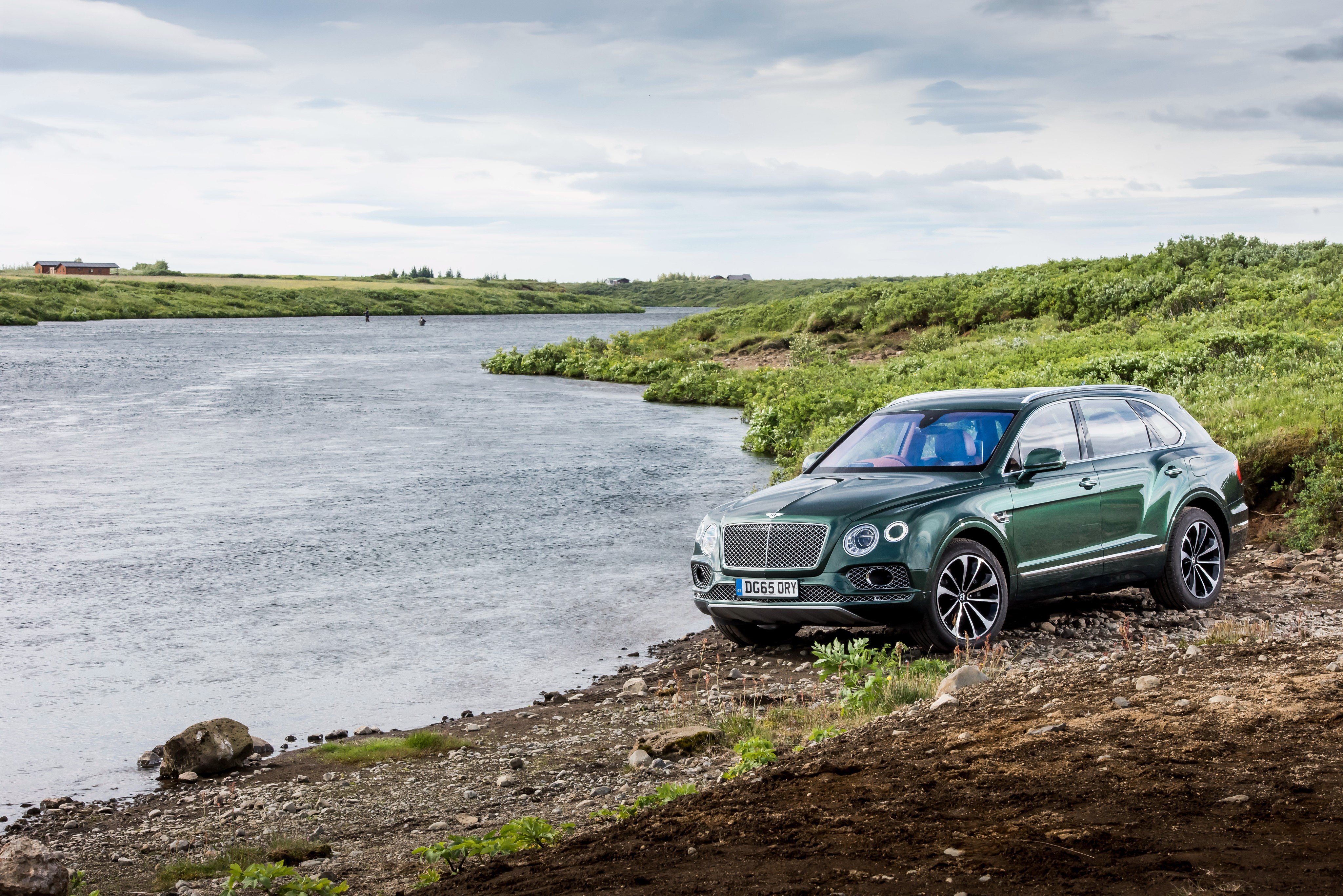 Green Bentley Bentayga SUV parked by a river HD Wallpaper