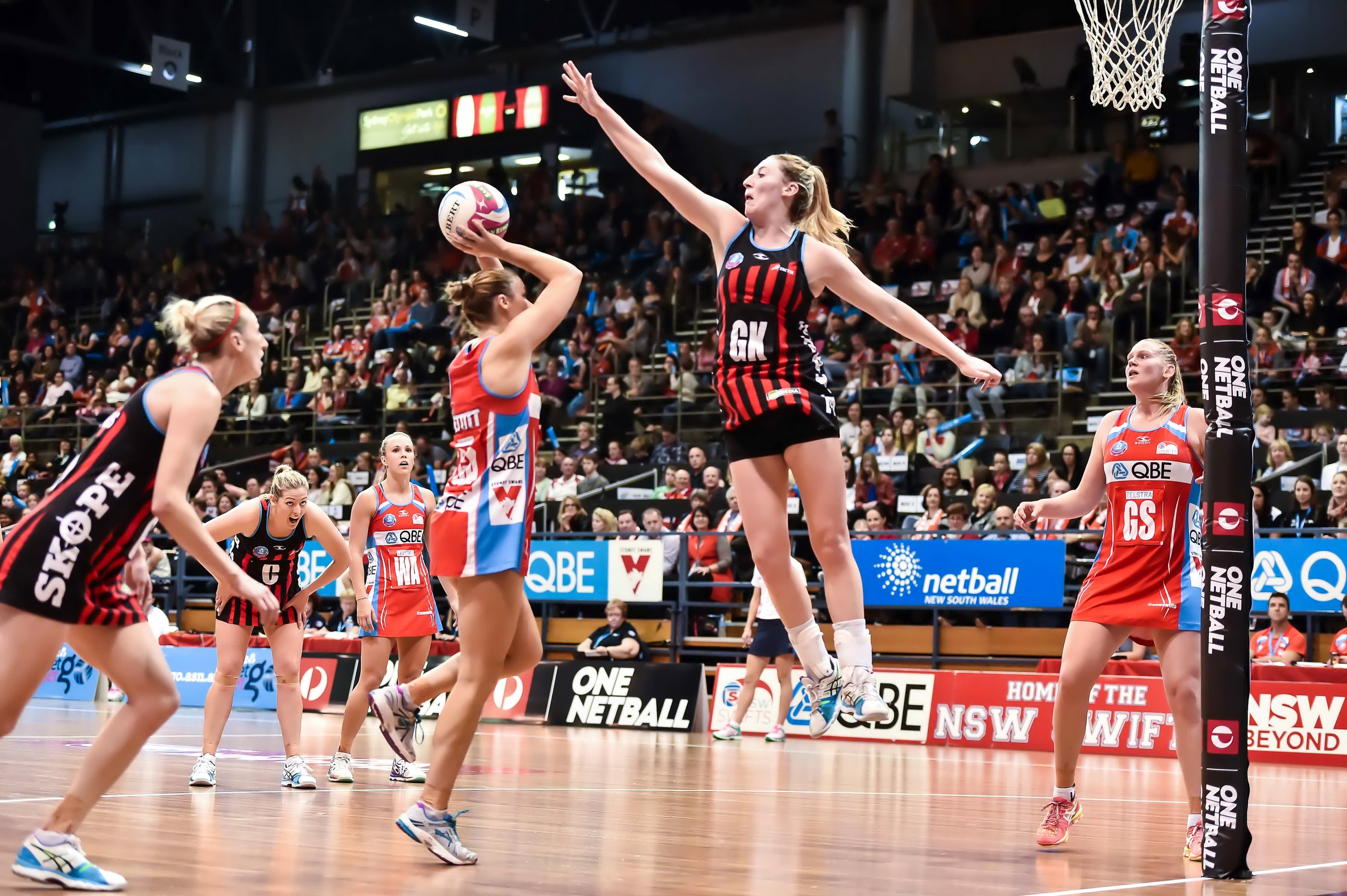 Netball players in action during a game HD Wallpaper