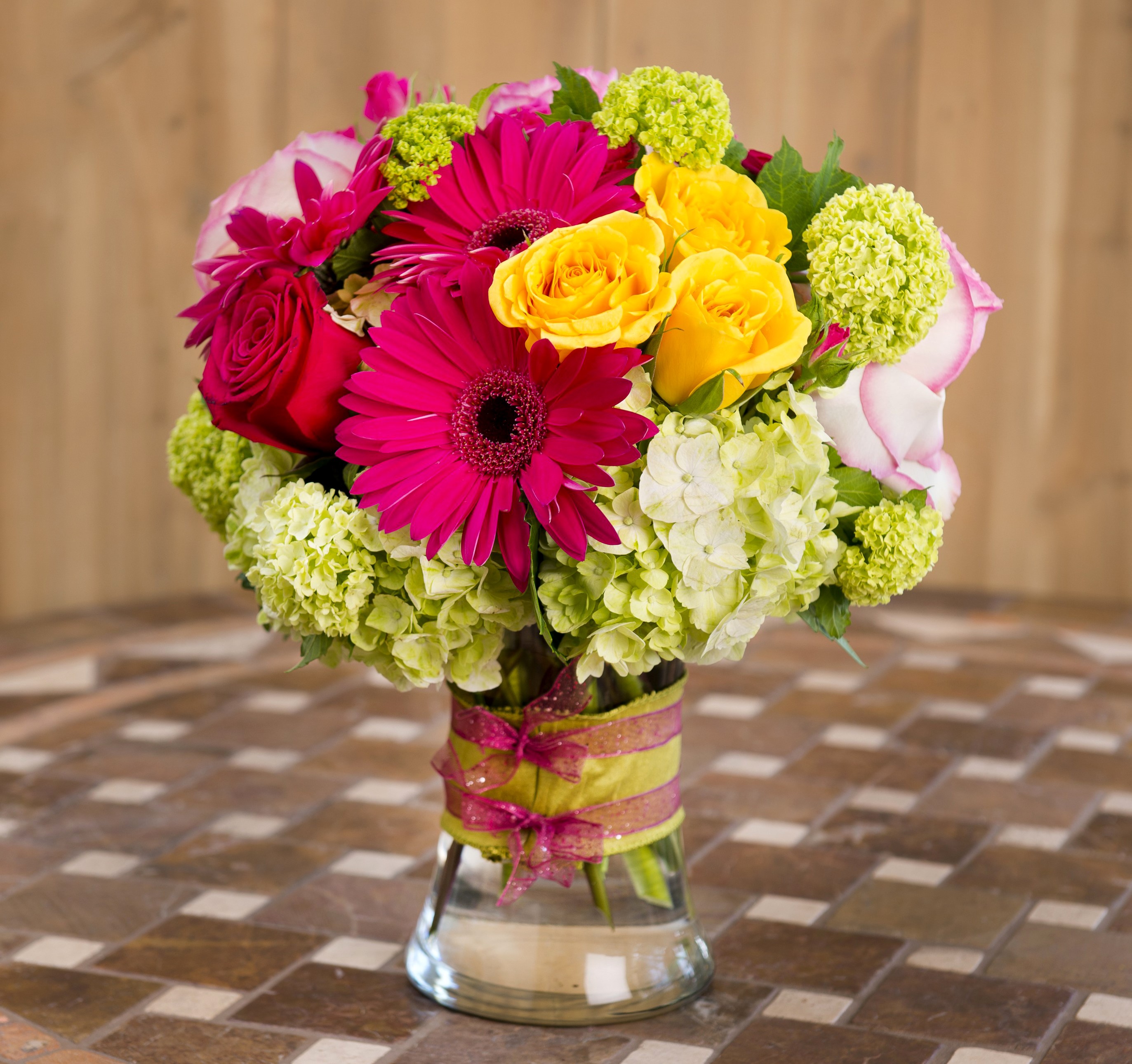 Vibrant floral arrangement in a glass vase HD Wallpaper
