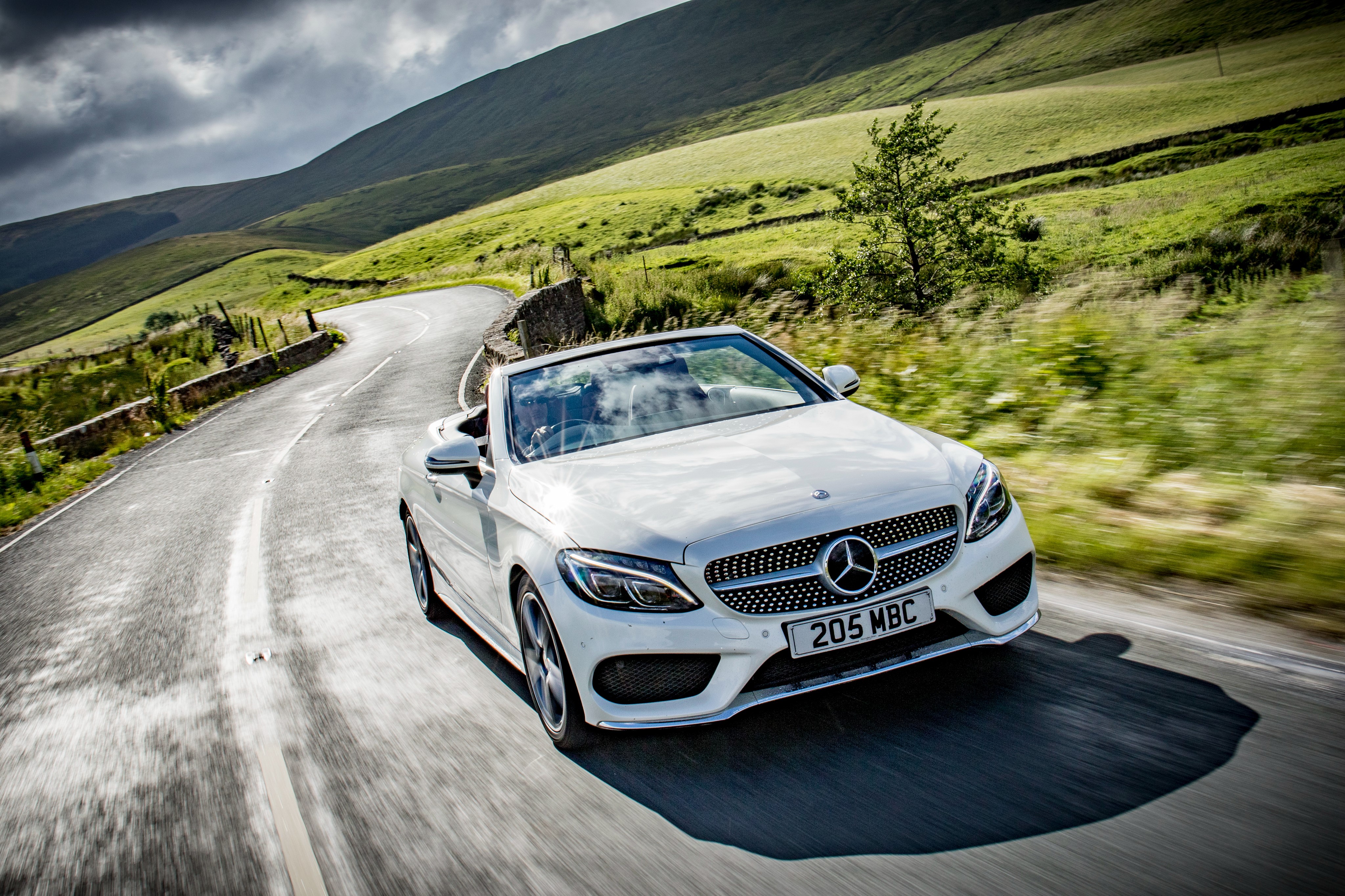 White Mercedes-Benz AMG C-Class Cabriolet on a Winding Road HD Wallpaper