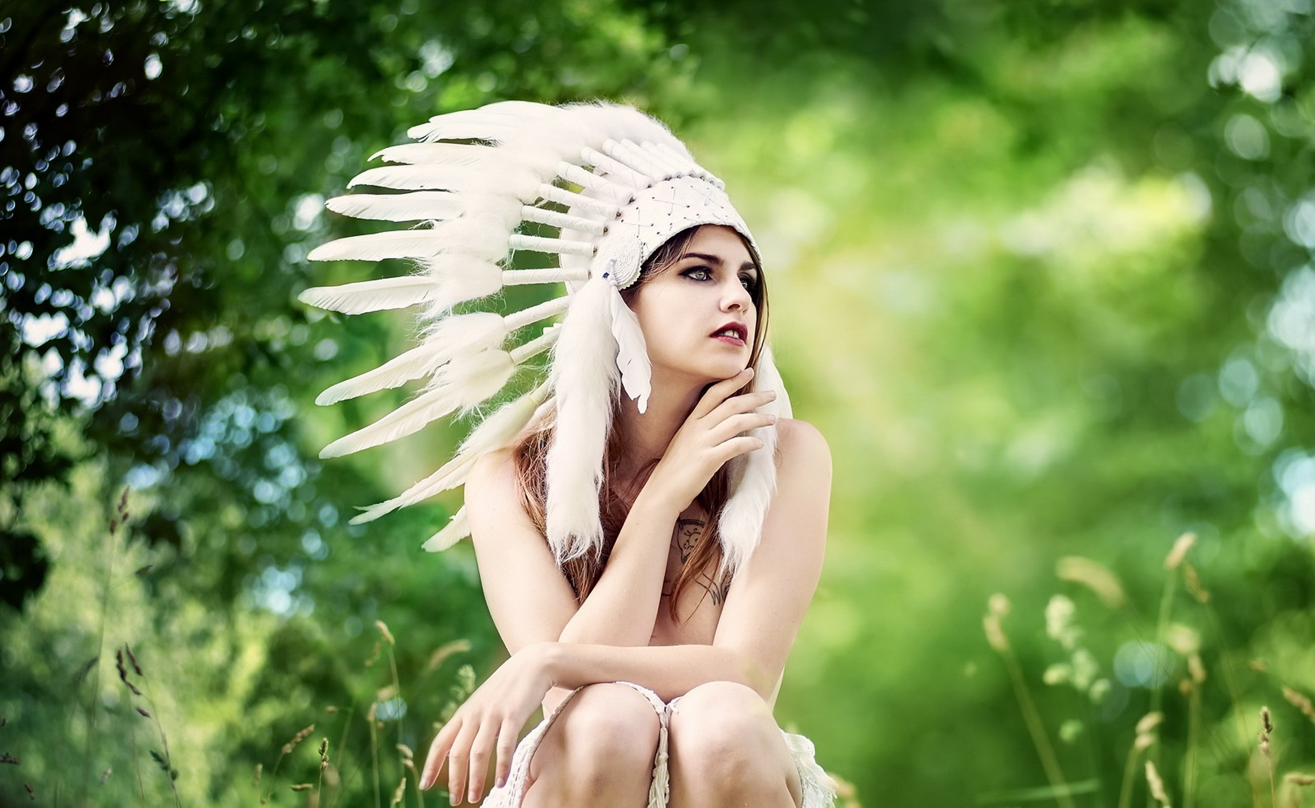 Woman wearing a white feather headdress outdoors HD Wallpaper