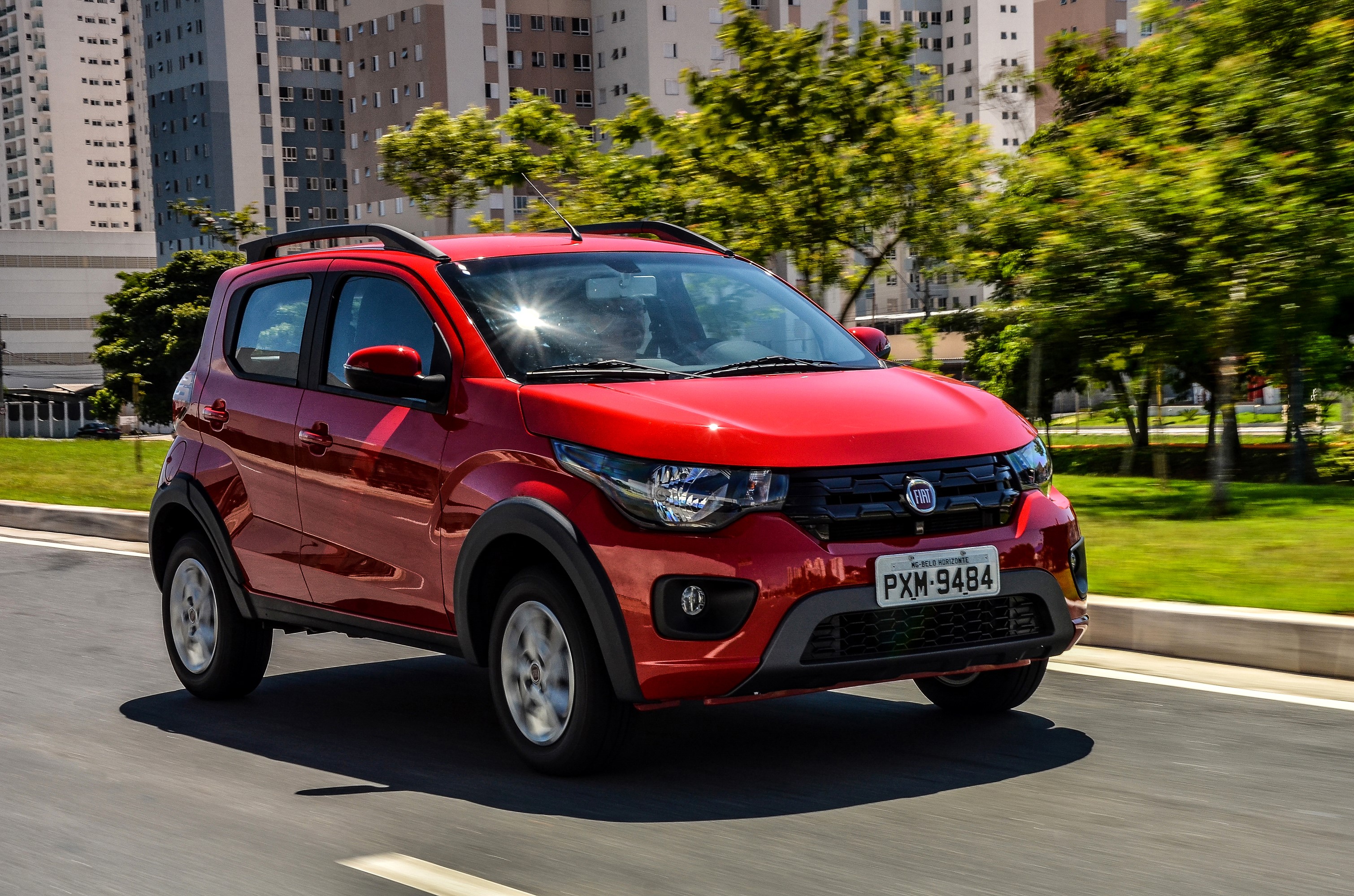 Red Fiat Mobi Way driving on a road HD Wallpaper