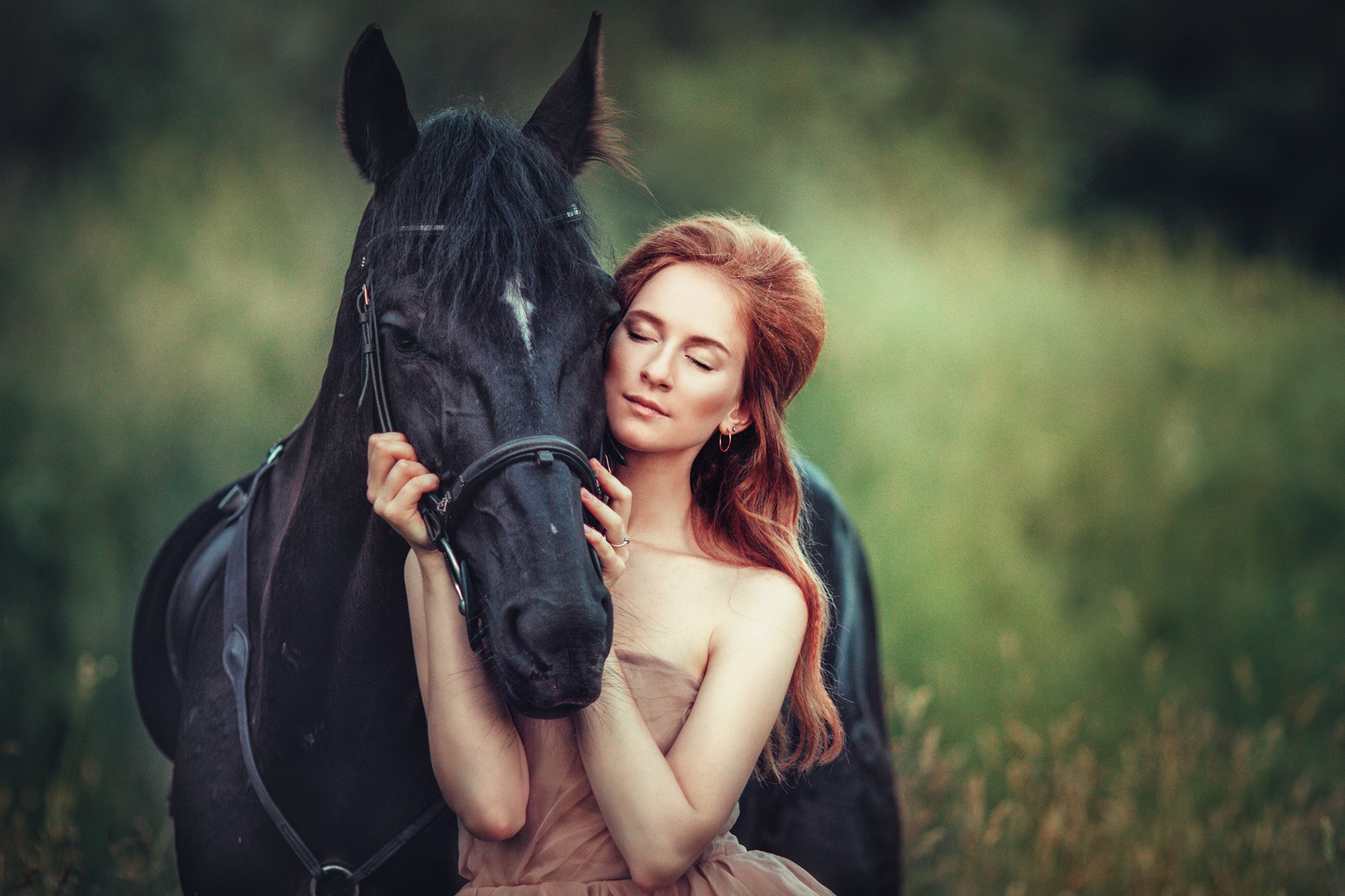 Woman embracing a black horse in a field HD Wallpaper
