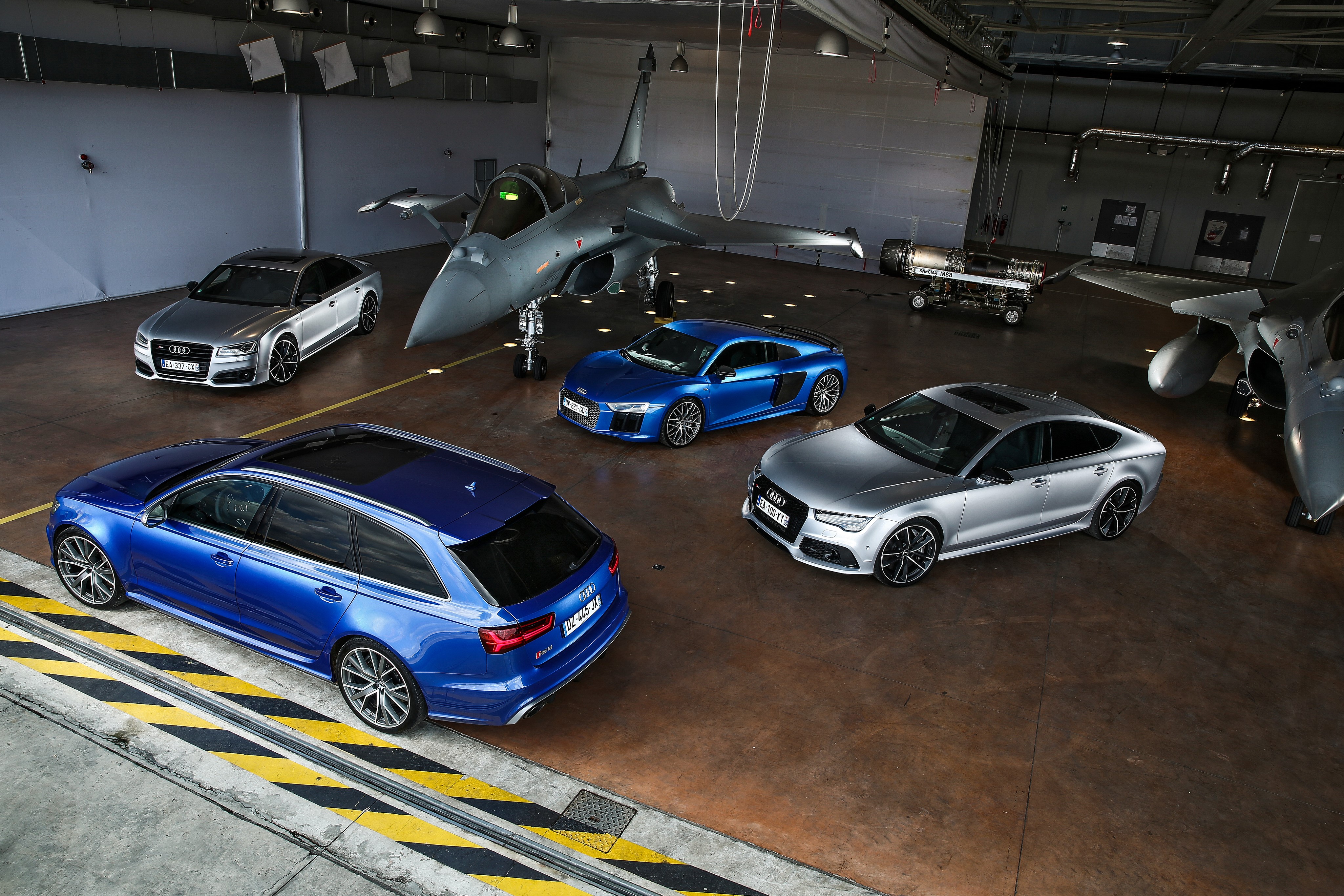 Audi cars and fighter jet in hangar HD Wallpaper