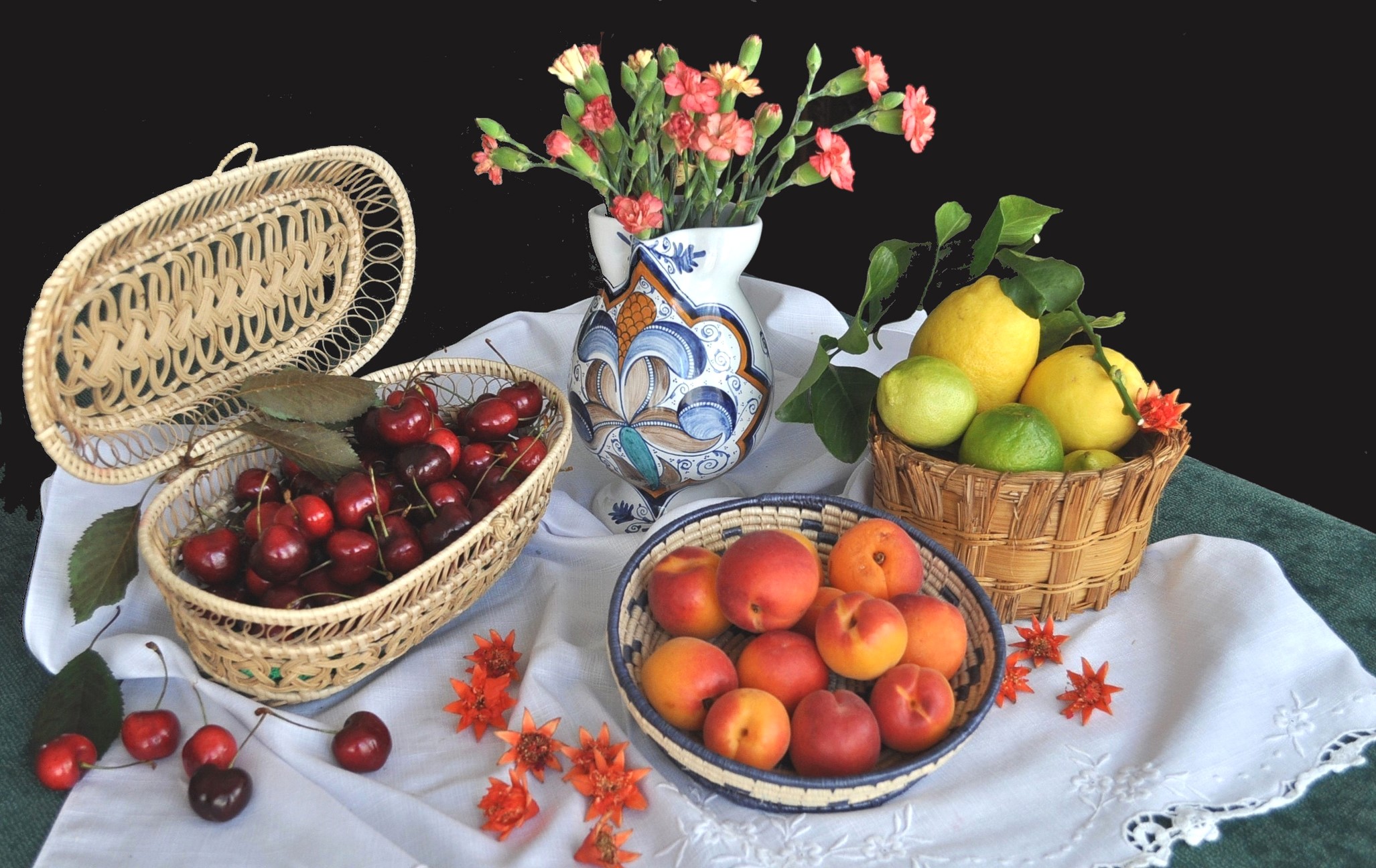 Still life with cherries, peaches, lemons, and carnations in a vase HD Wallpaper