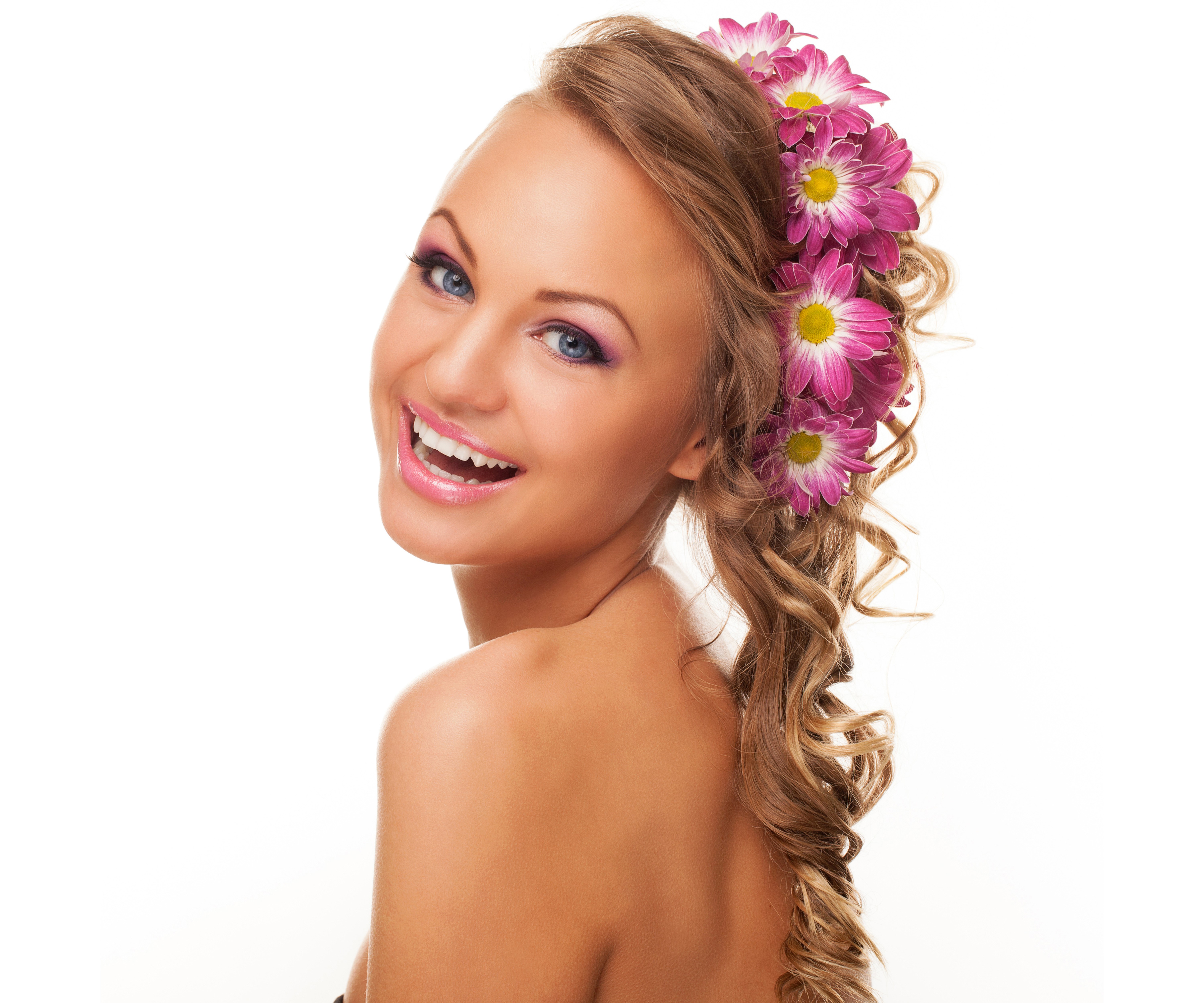 Woman with Chrysanthemums in Brown Hair Smiling HD Wallpaper