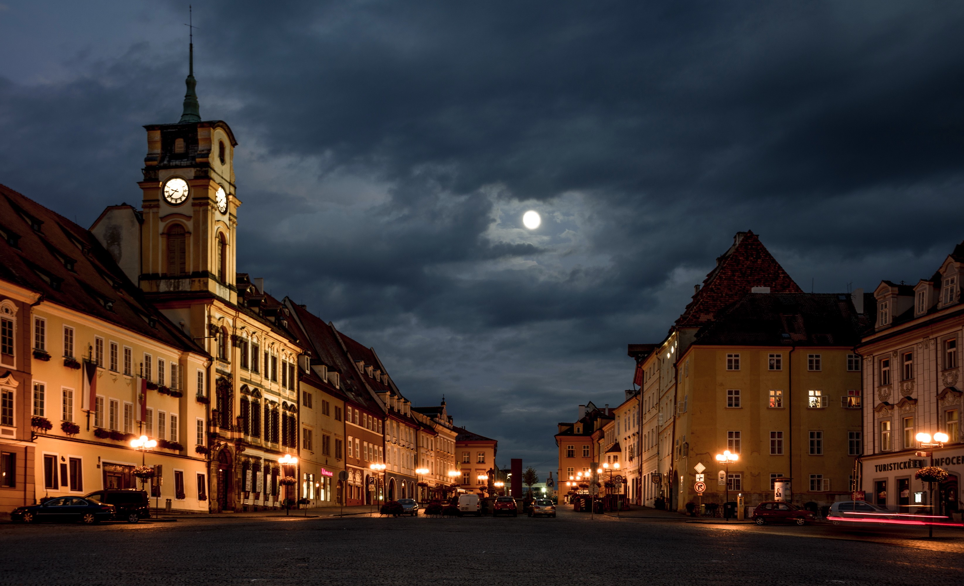 Town square at night with moon and clock tower HD Wallpaper