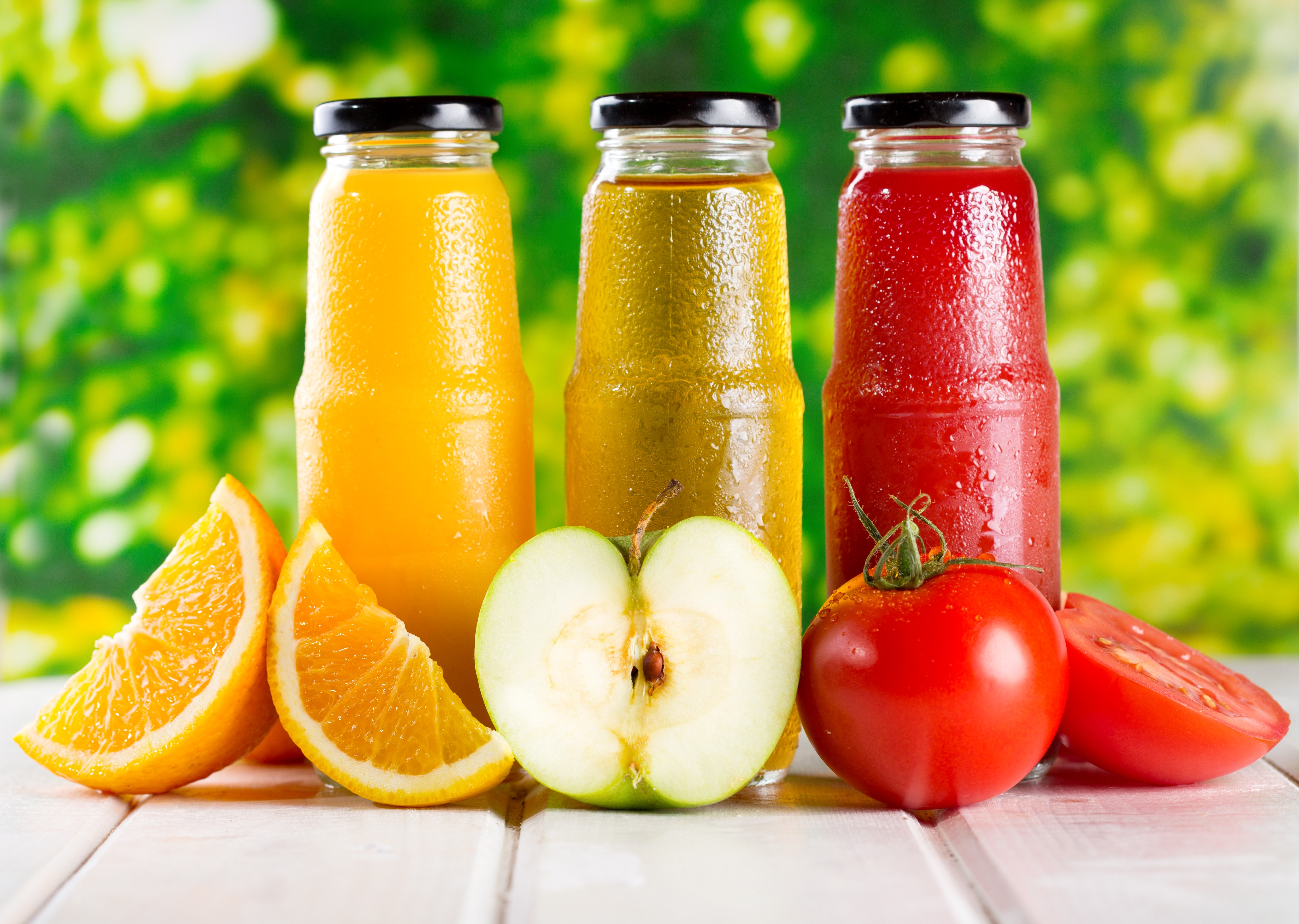 Three bottles of juice with fruits HD Wallpaper