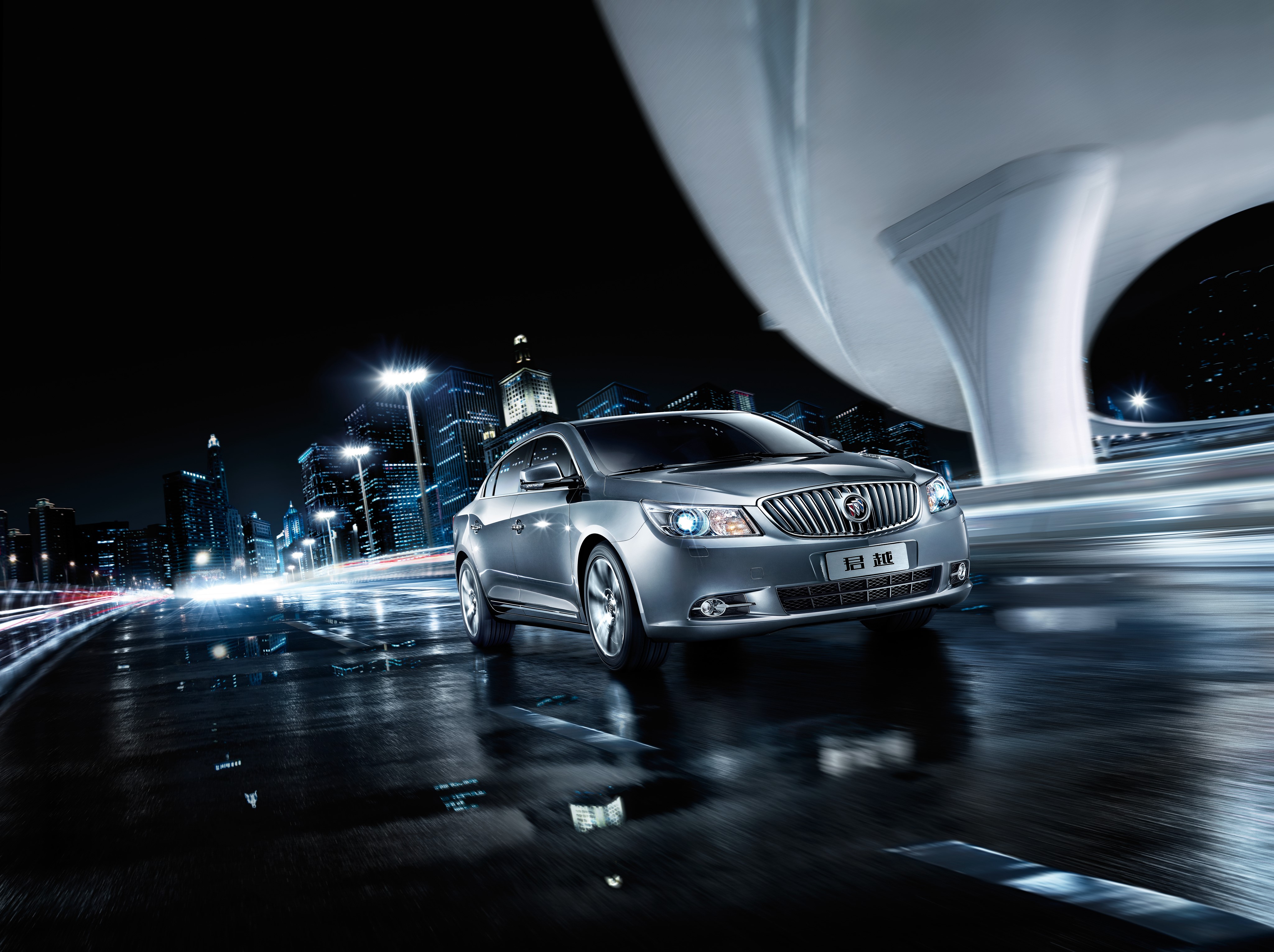 Buick LaCrosse driving at night in a city HD Wallpaper