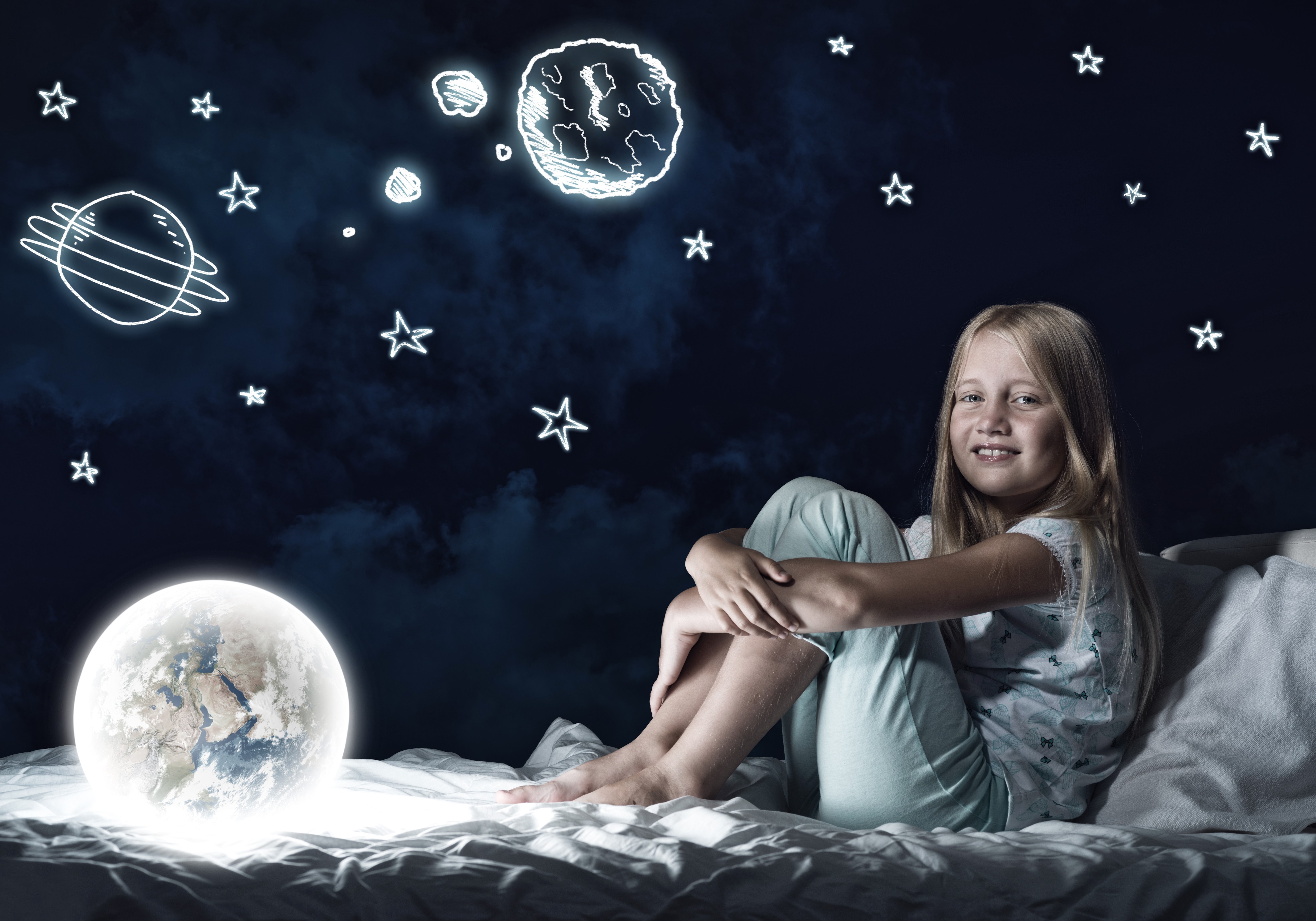 Girl in bed with glowing Earth and drawn stars HD Wallpaper