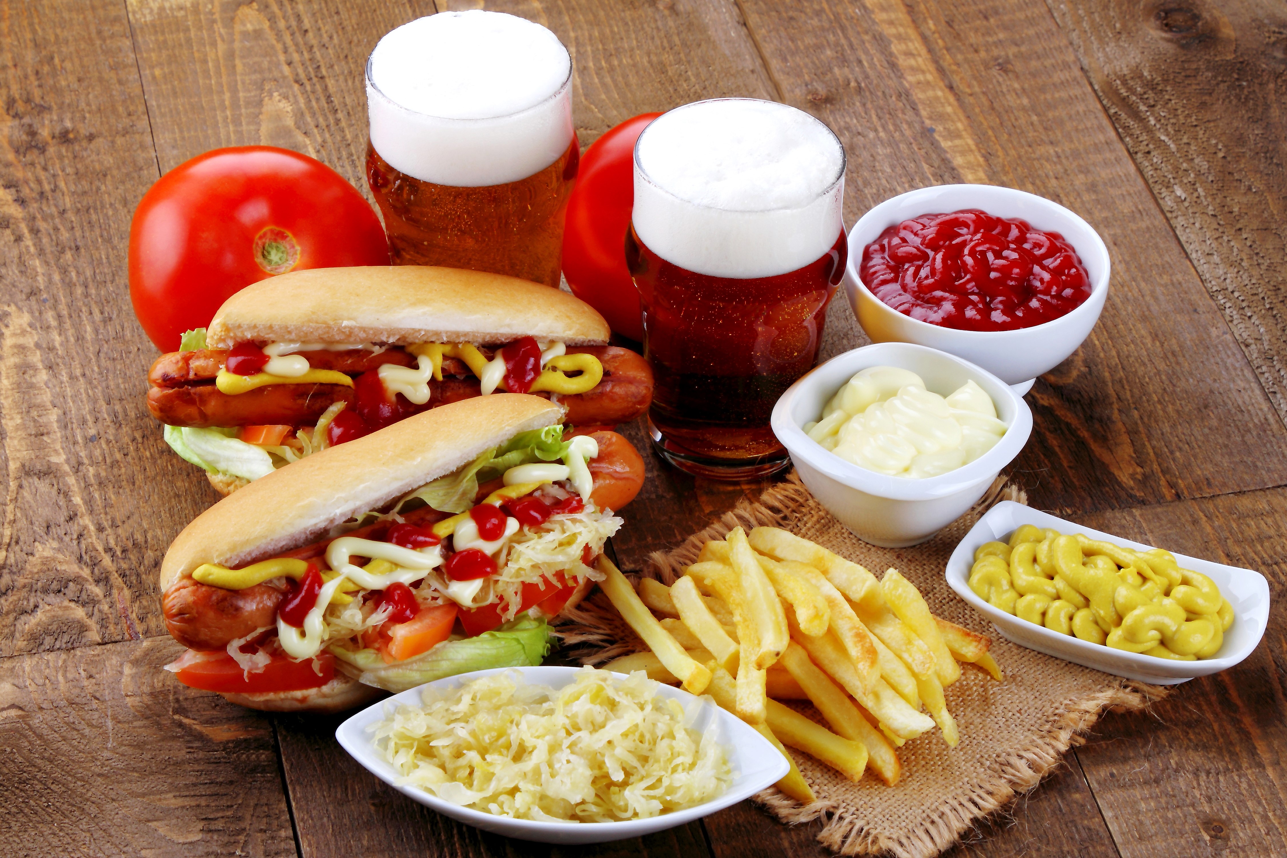 Hot dogs, French fries, and beer with condiments HD Wallpaper