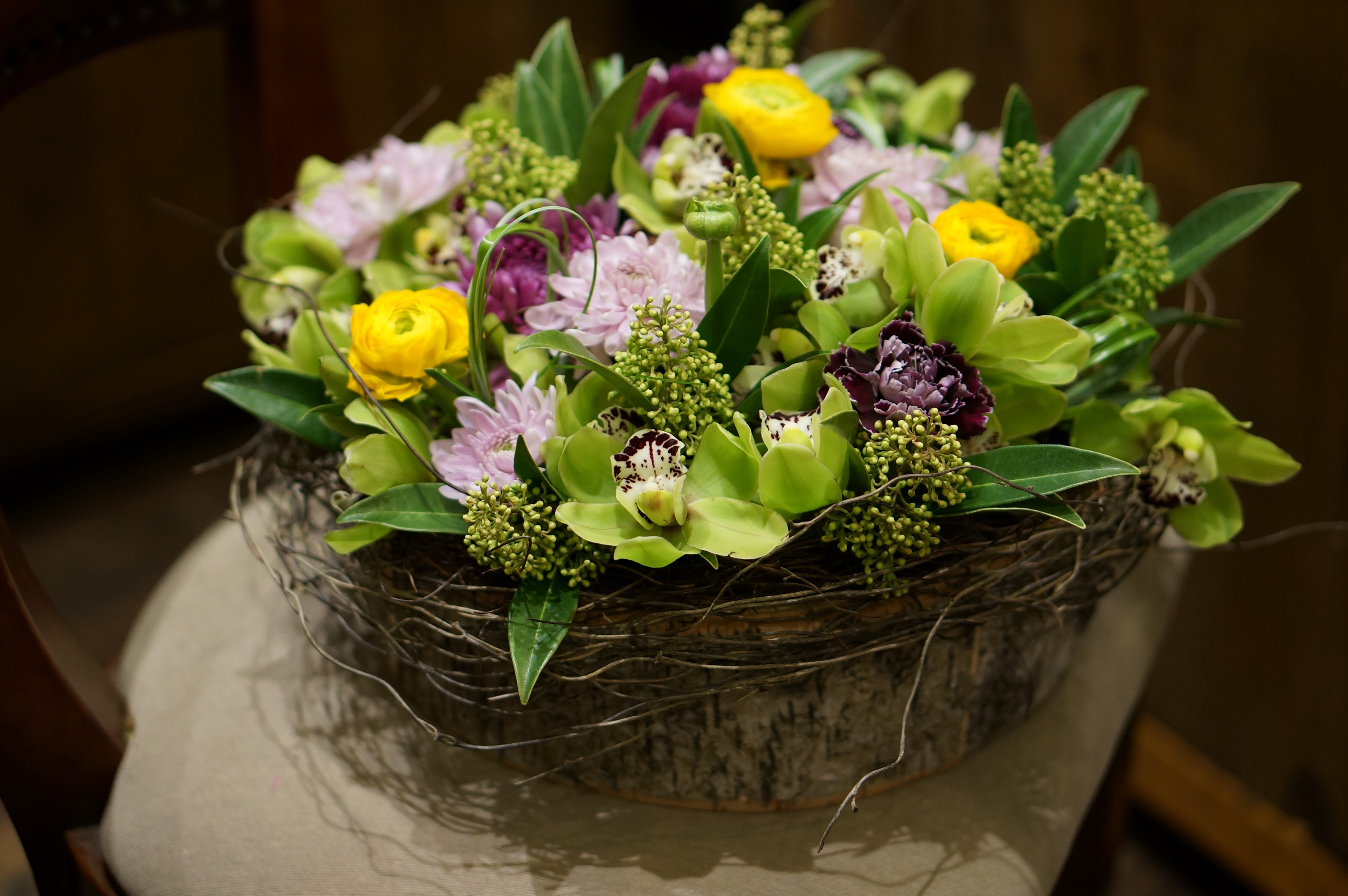 Orchid and Ranunculus Flower Arrangement in Rustic Basket HD Wallpaper
