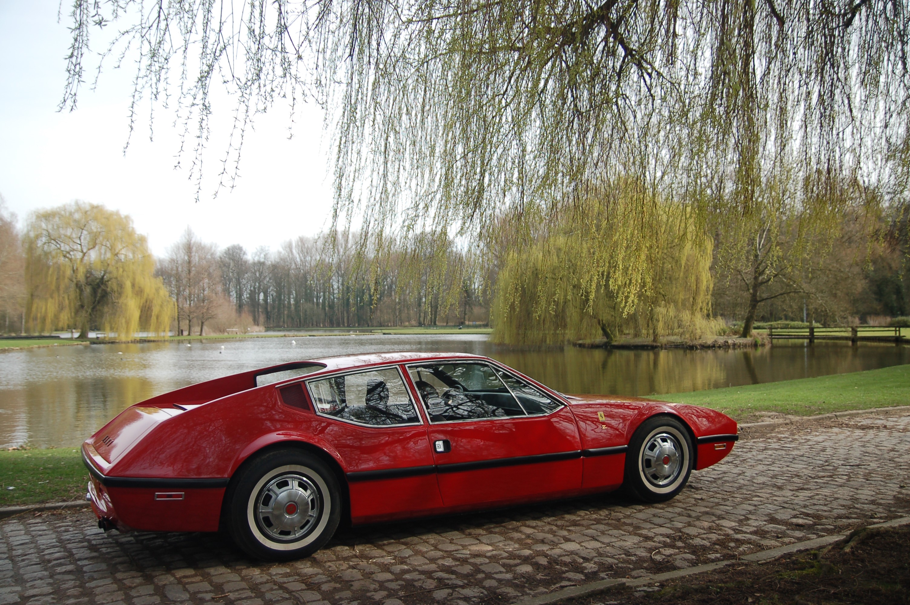 Red 1970 NART Zagato car by a lake HD Wallpaper