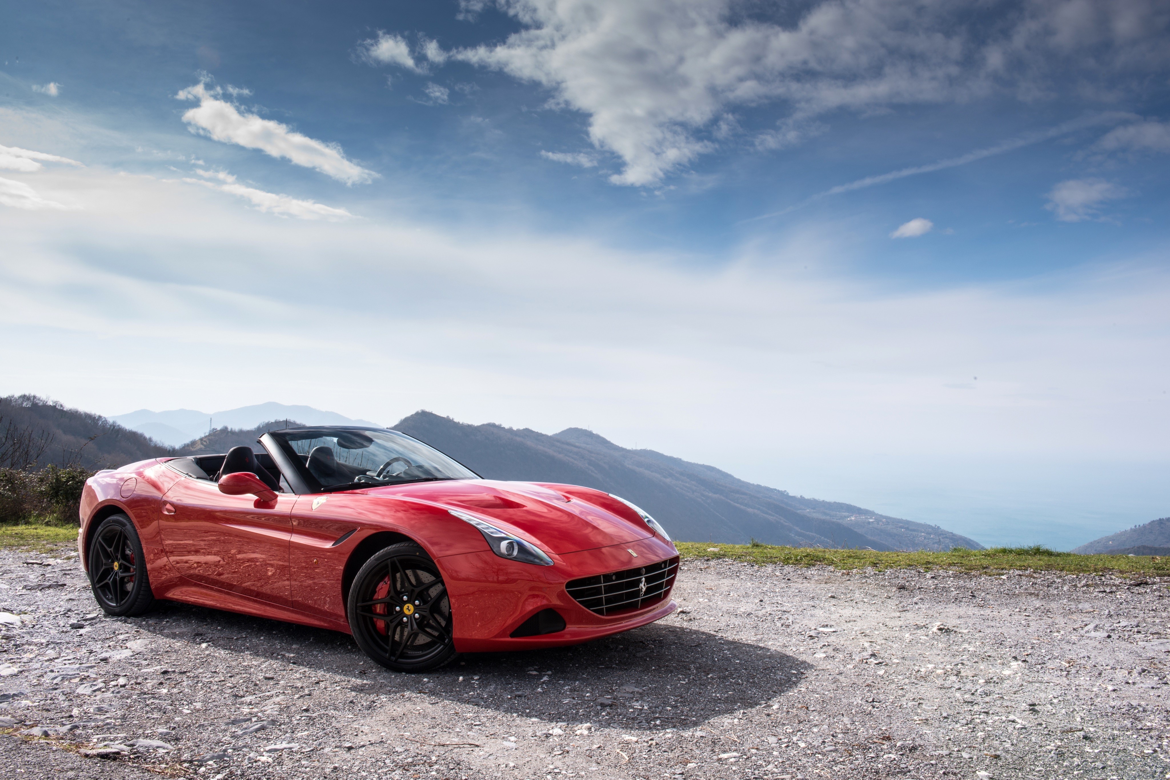 Red Ferrari California T Cabriolet on a Mountain Road HD Wallpaper