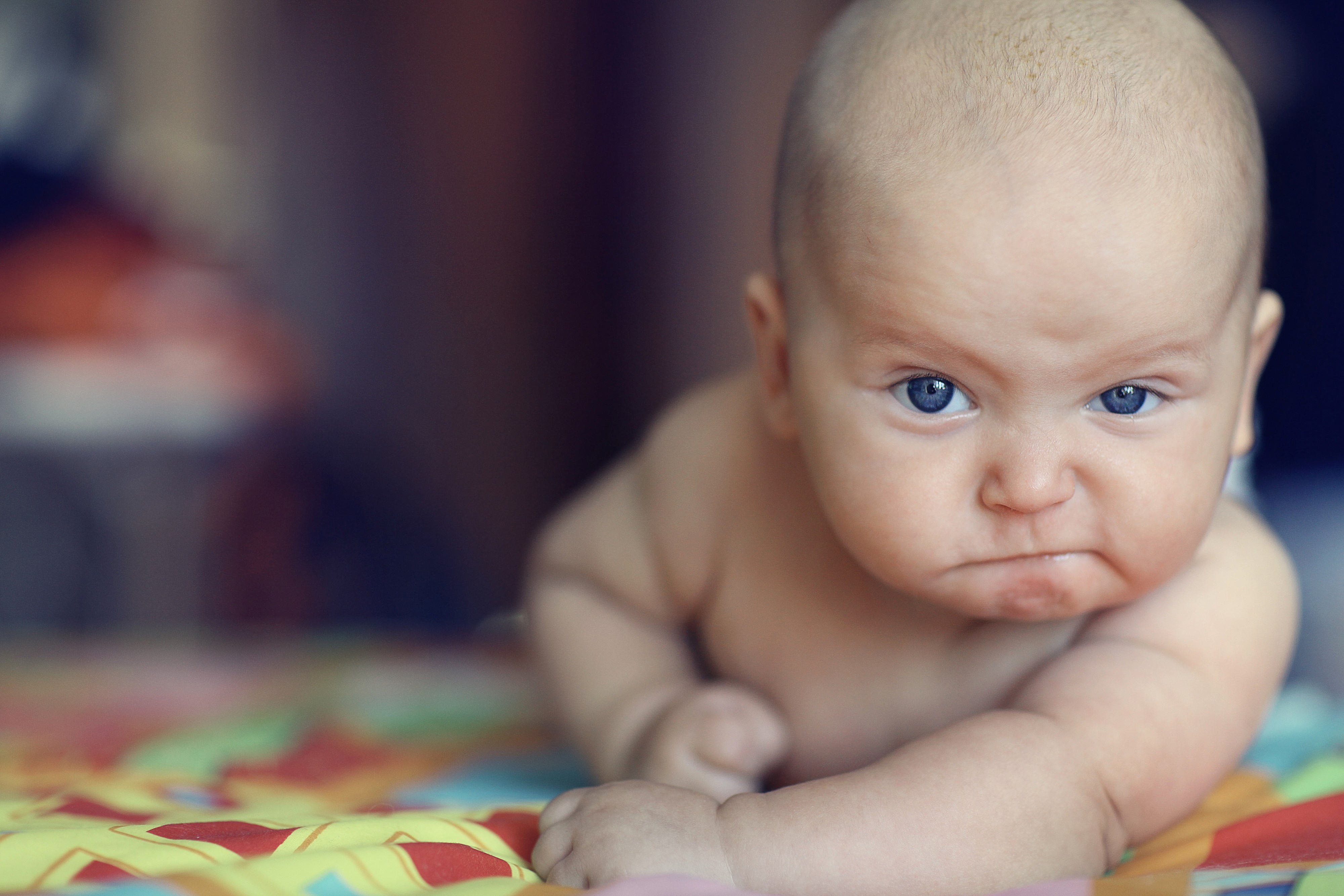 Baby with an angry expression HD Wallpaper