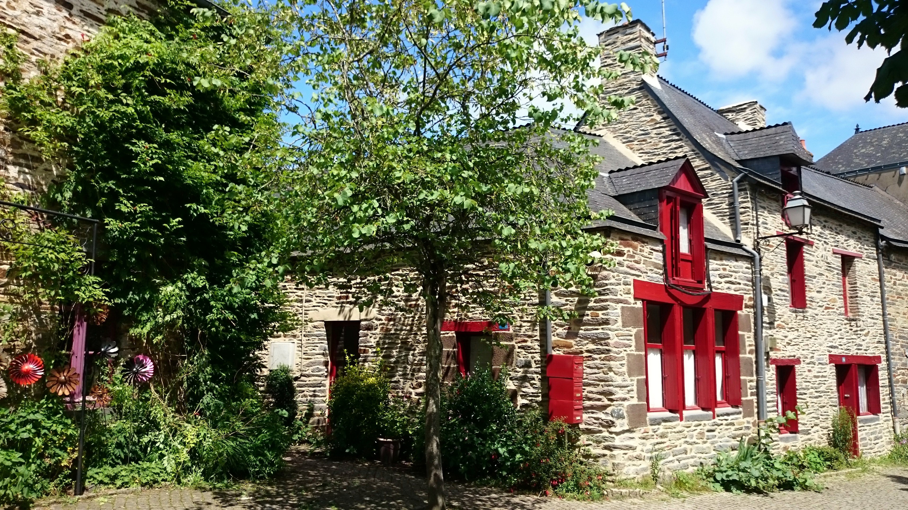 Stone Houses with Red Shutters in Brittany, France HD Wallpaper