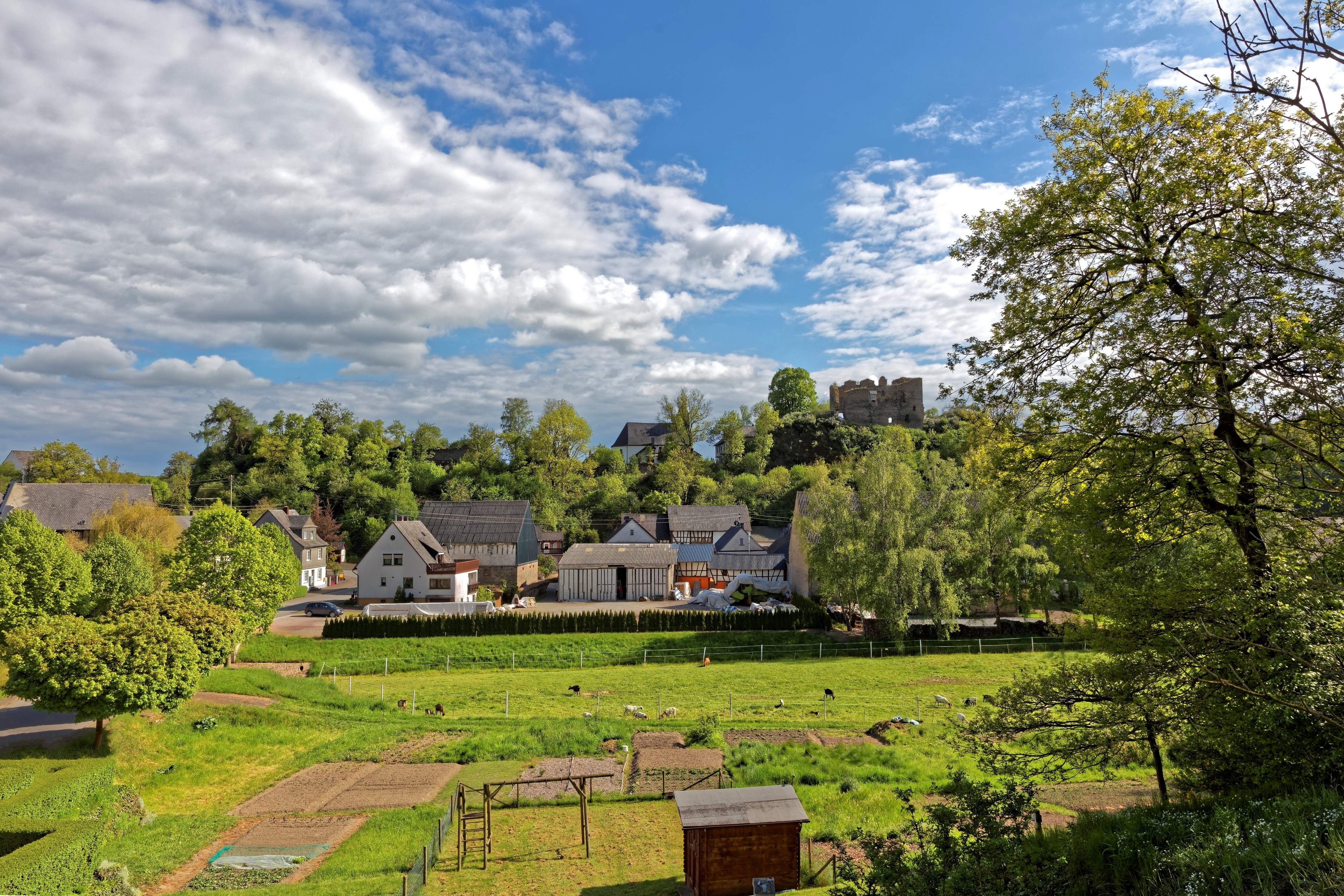 Village with castle ruins in Germany HD Wallpaper
