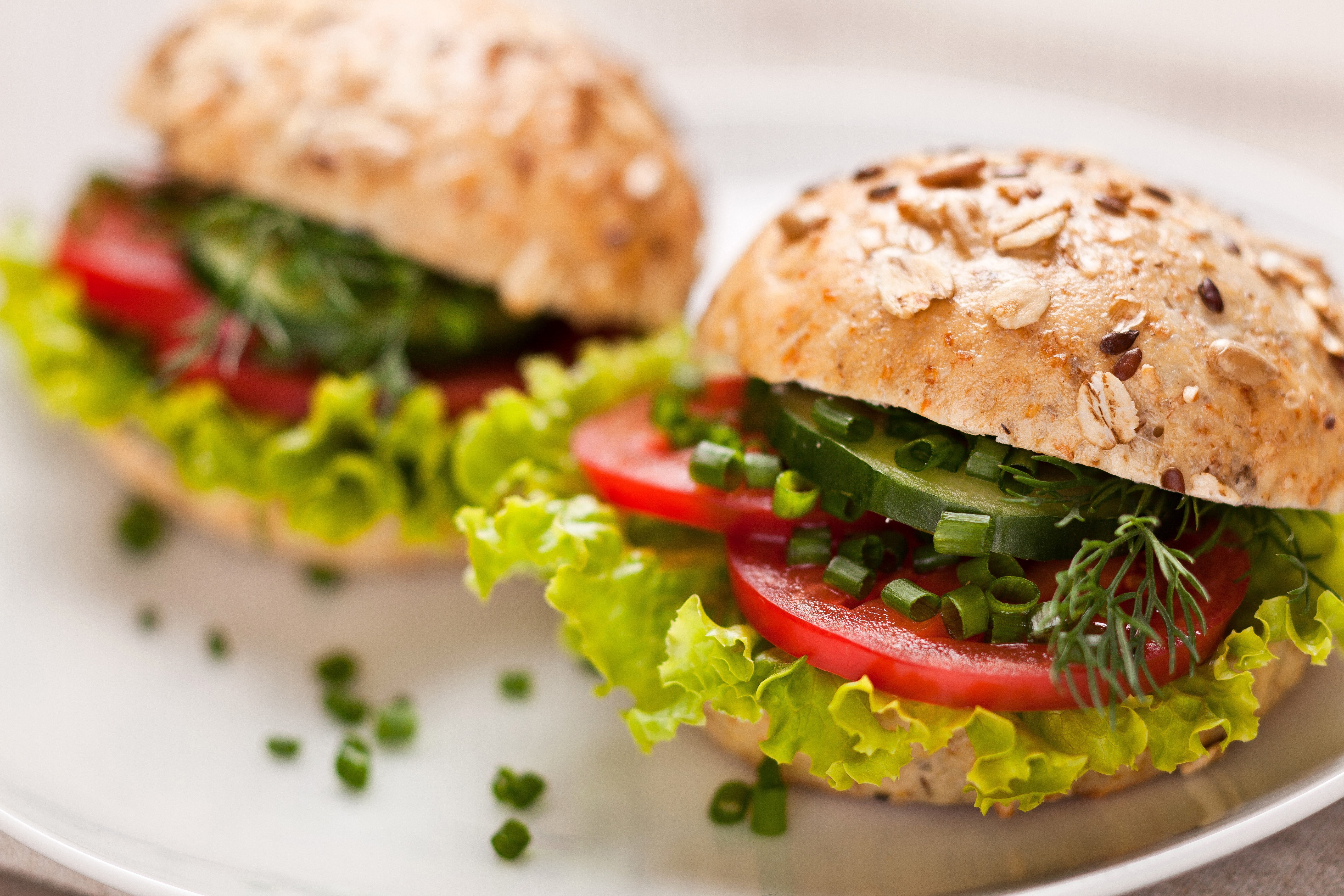 Two healthy sandwiches with vegetables on a plate HD Wallpaper