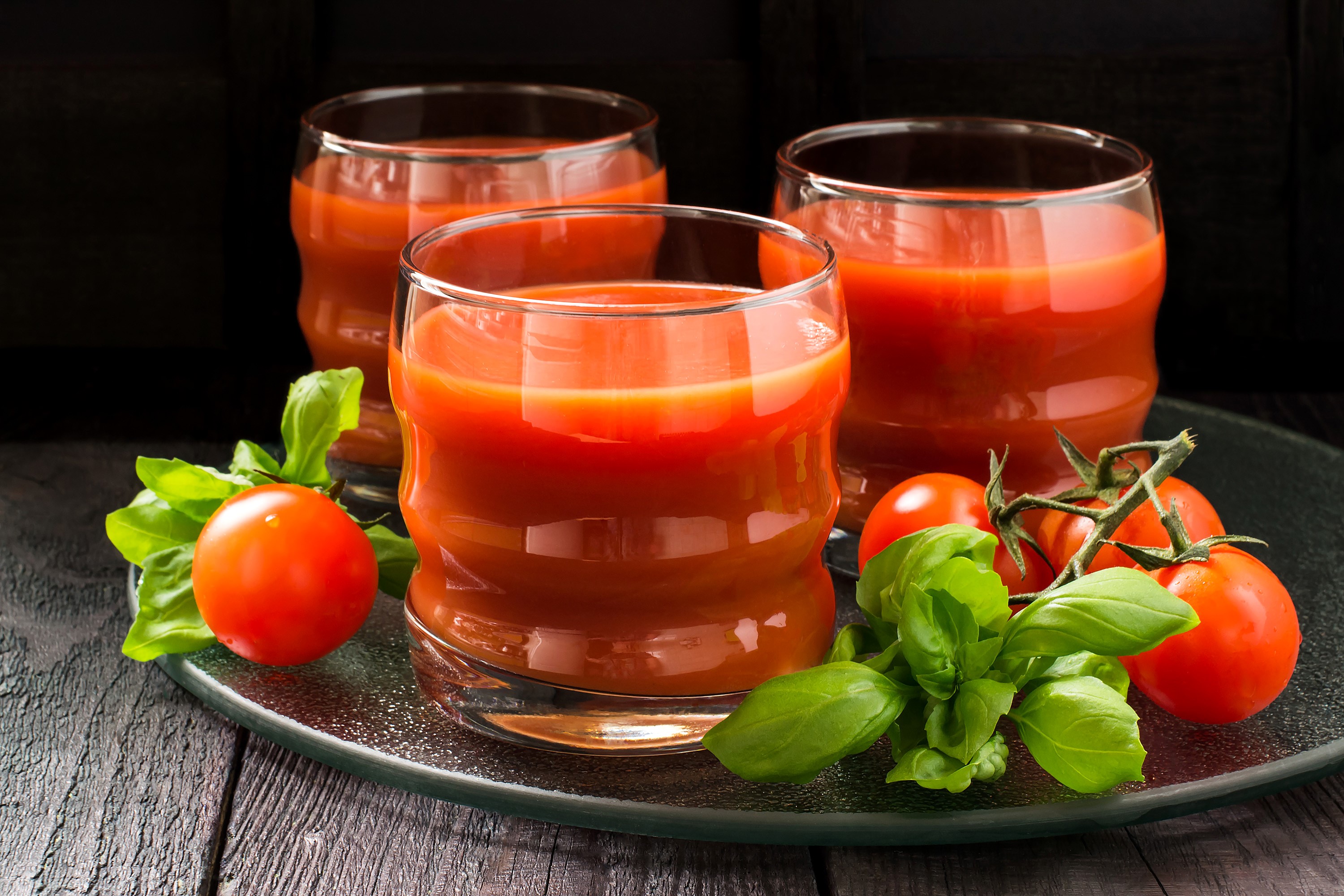 Three glasses of tomato juice with tomatoes and basil HD Wallpaper