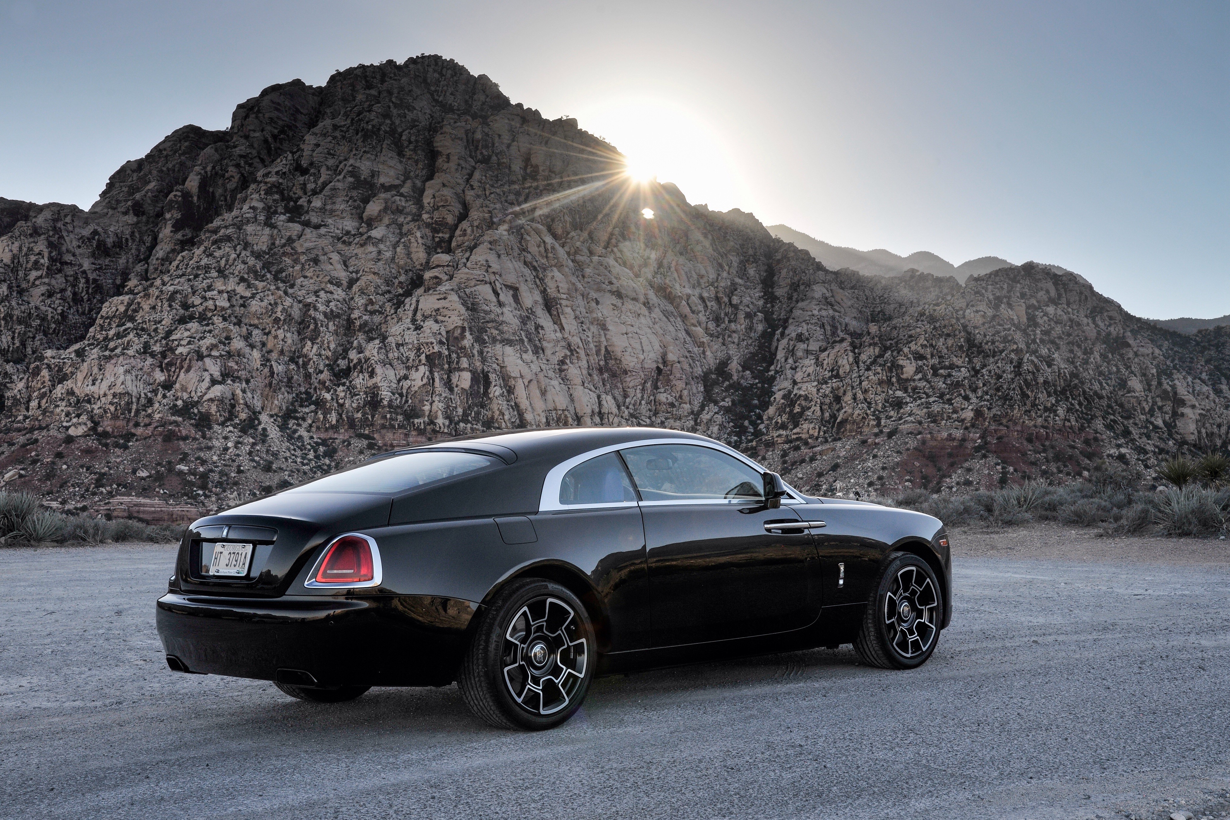 Black Rolls-Royce Wraith in a rocky landscape HD Wallpaper