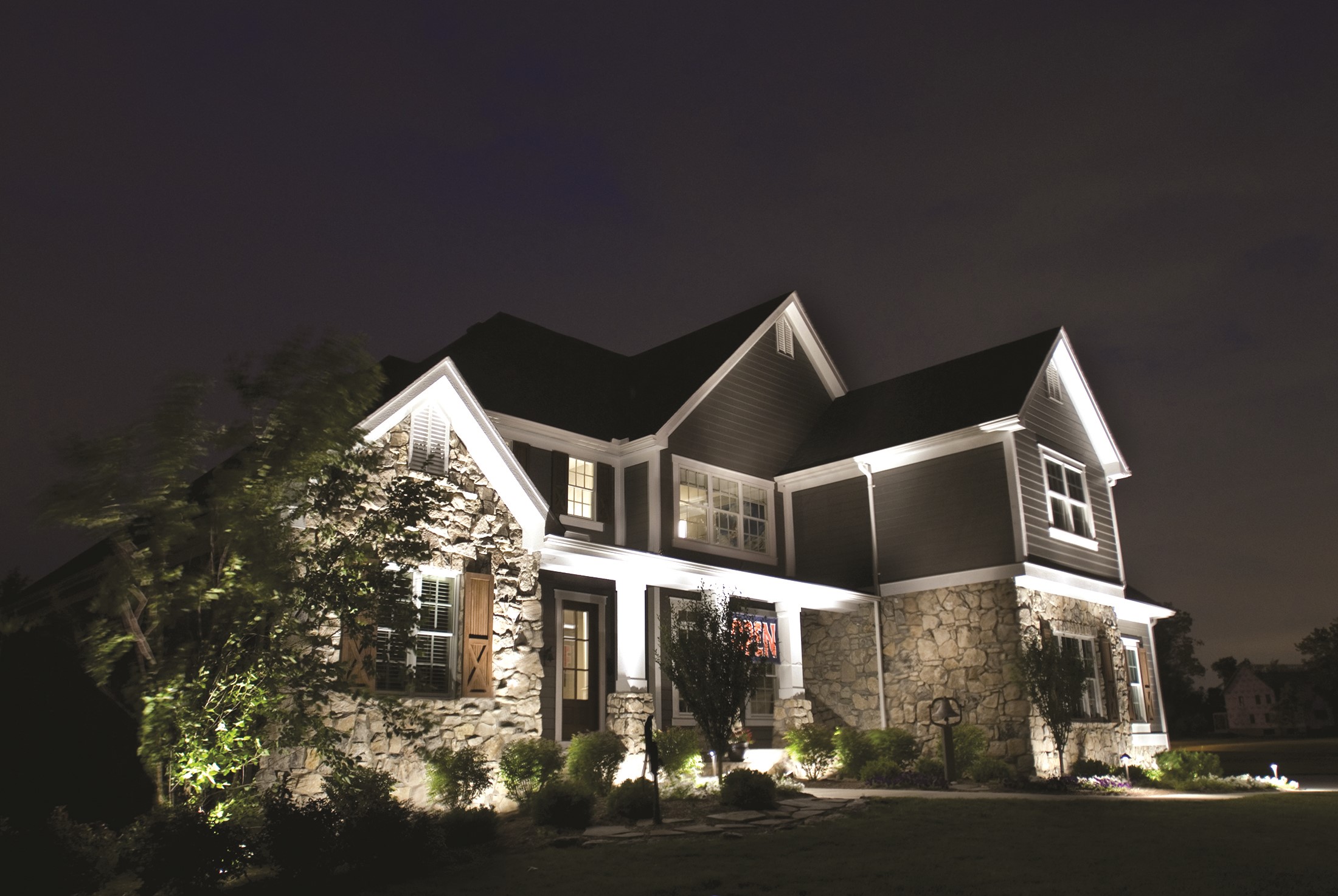 Luxury Stone and Siding House at Night HD Wallpaper