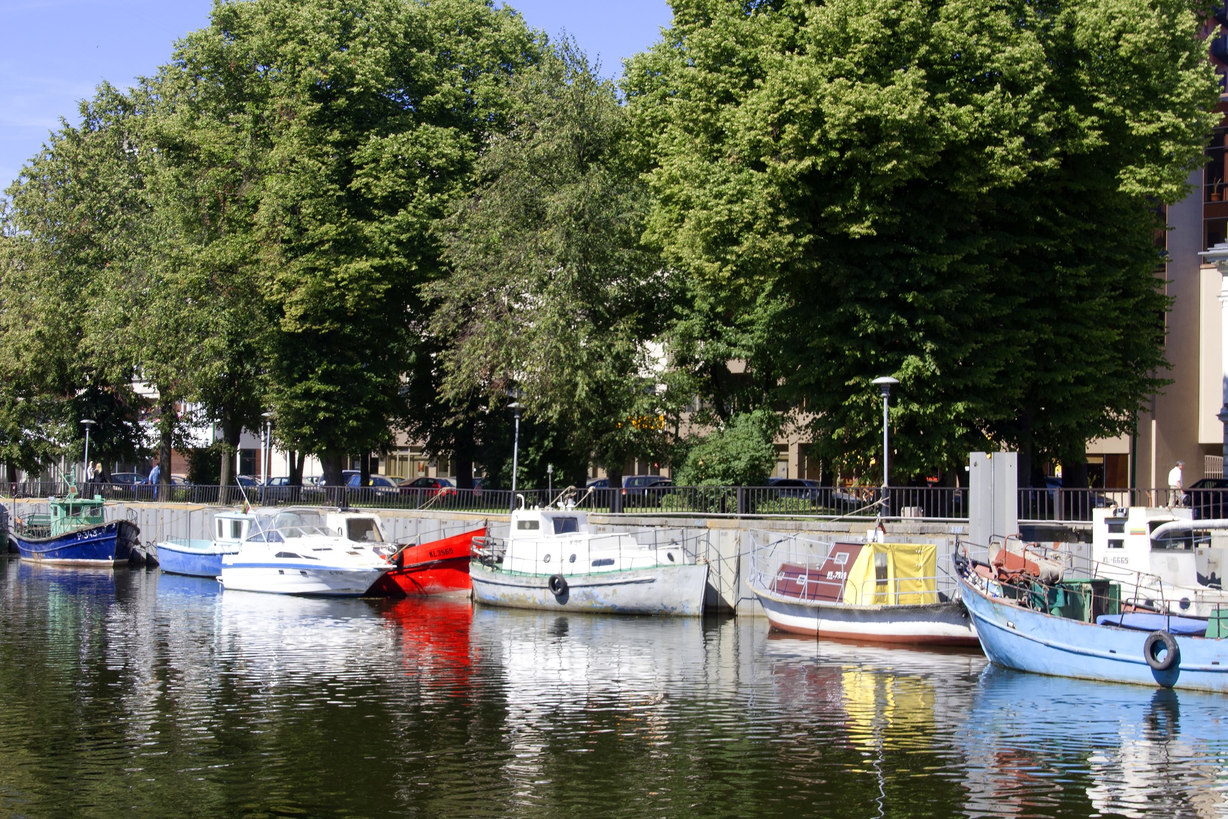 Boats docked in a canal in Klaipeda, Lithuania HD Wallpaper