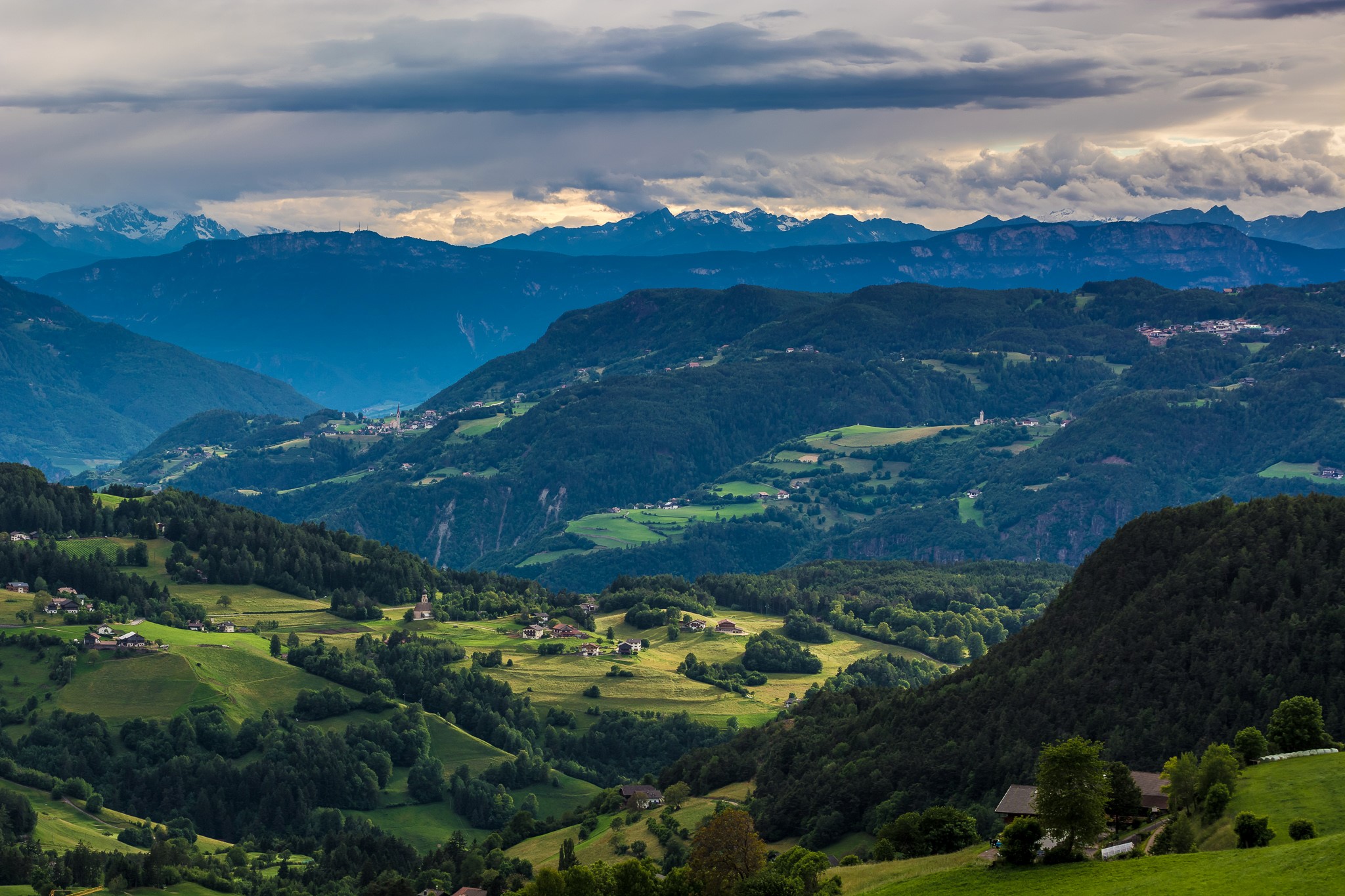 Mountain landscape with villages and forests in Ritten, Italy HD Wallpaper