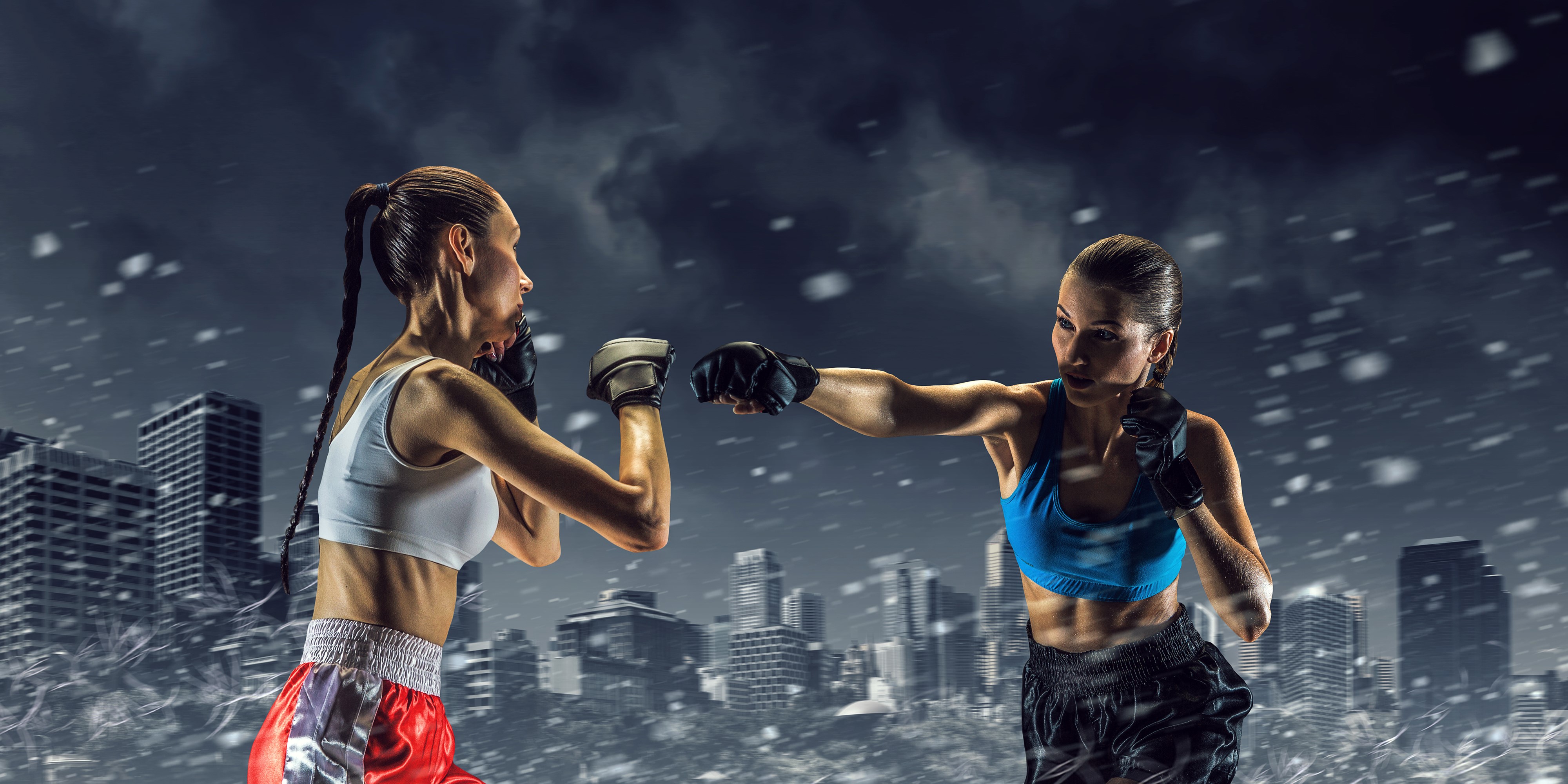 Two female boxers fighting in a city HD Wallpaper