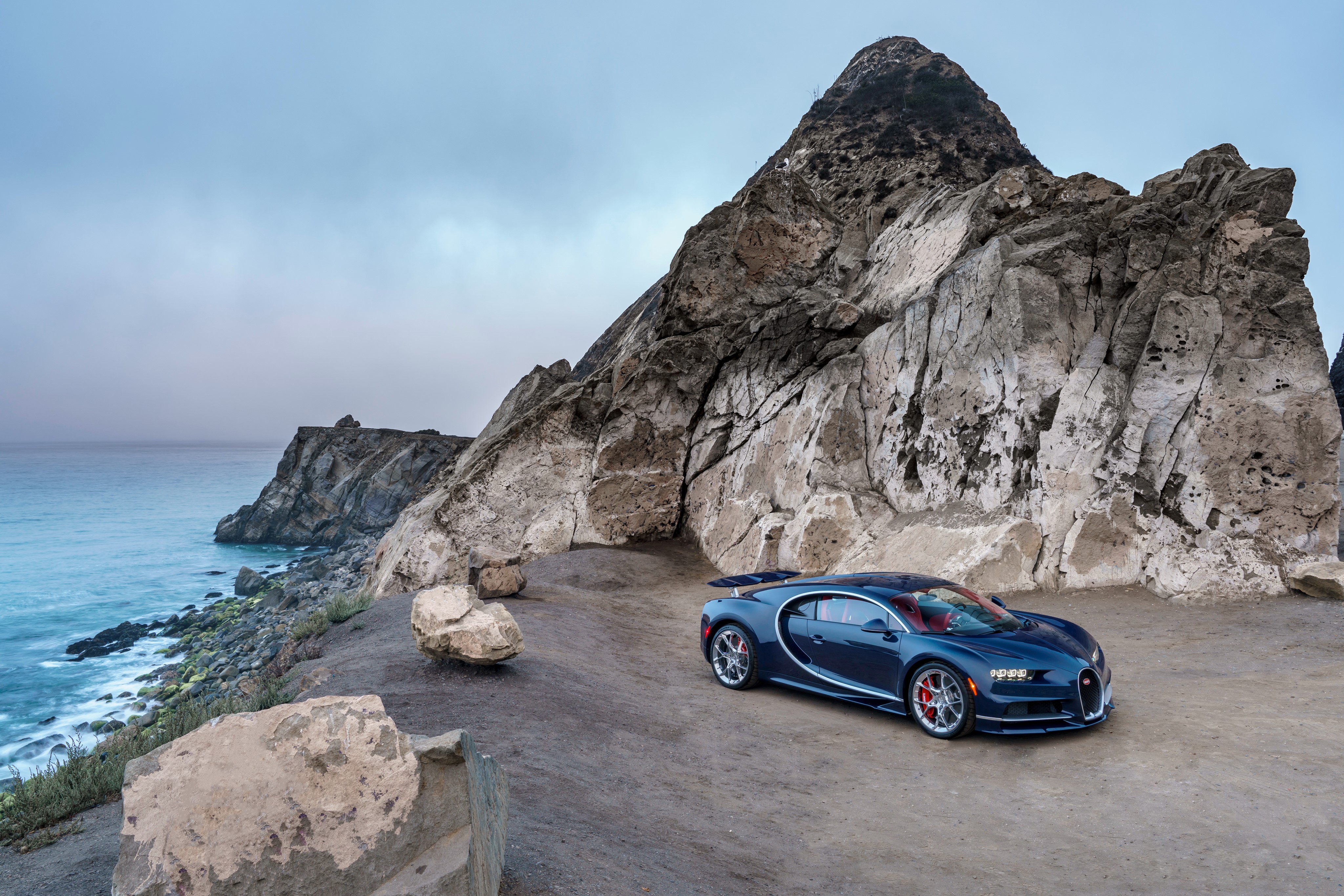 4K Bugatti Chiron on a rocky coast HD Wallpaper