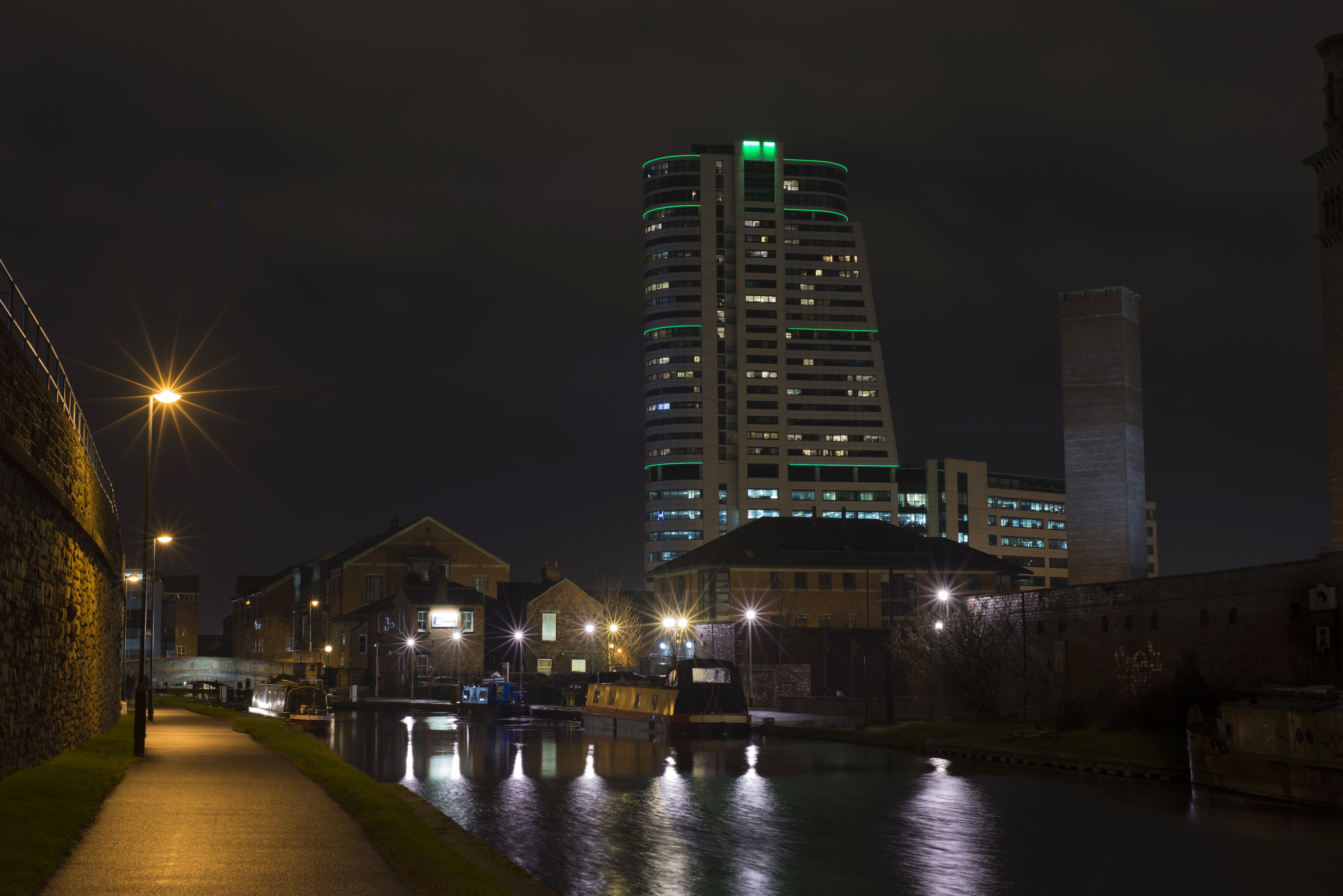 Night view of Leeds canal with modern buildings HD Wallpaper