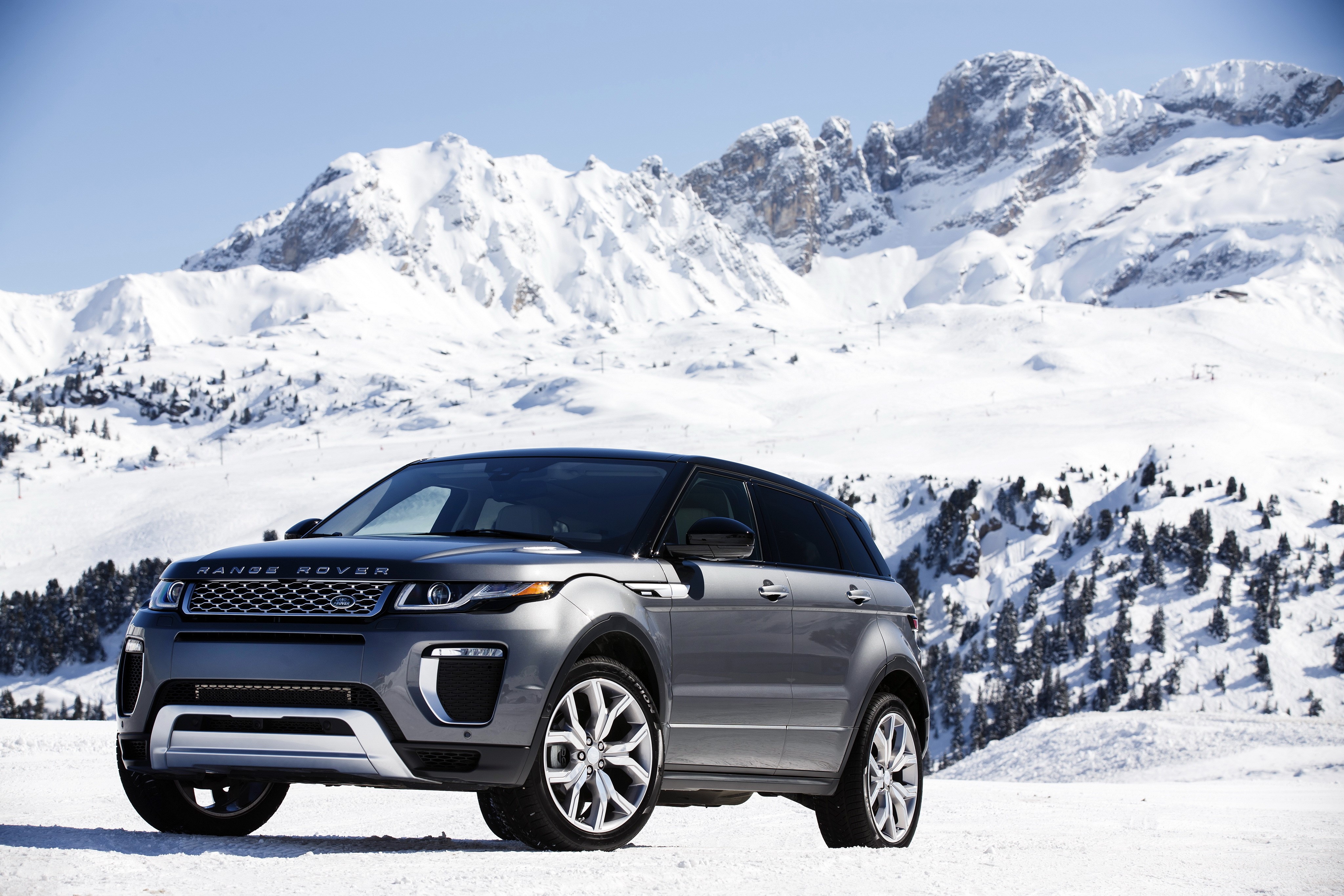 4K Range Rover Evoque in snowy mountains HD Wallpaper