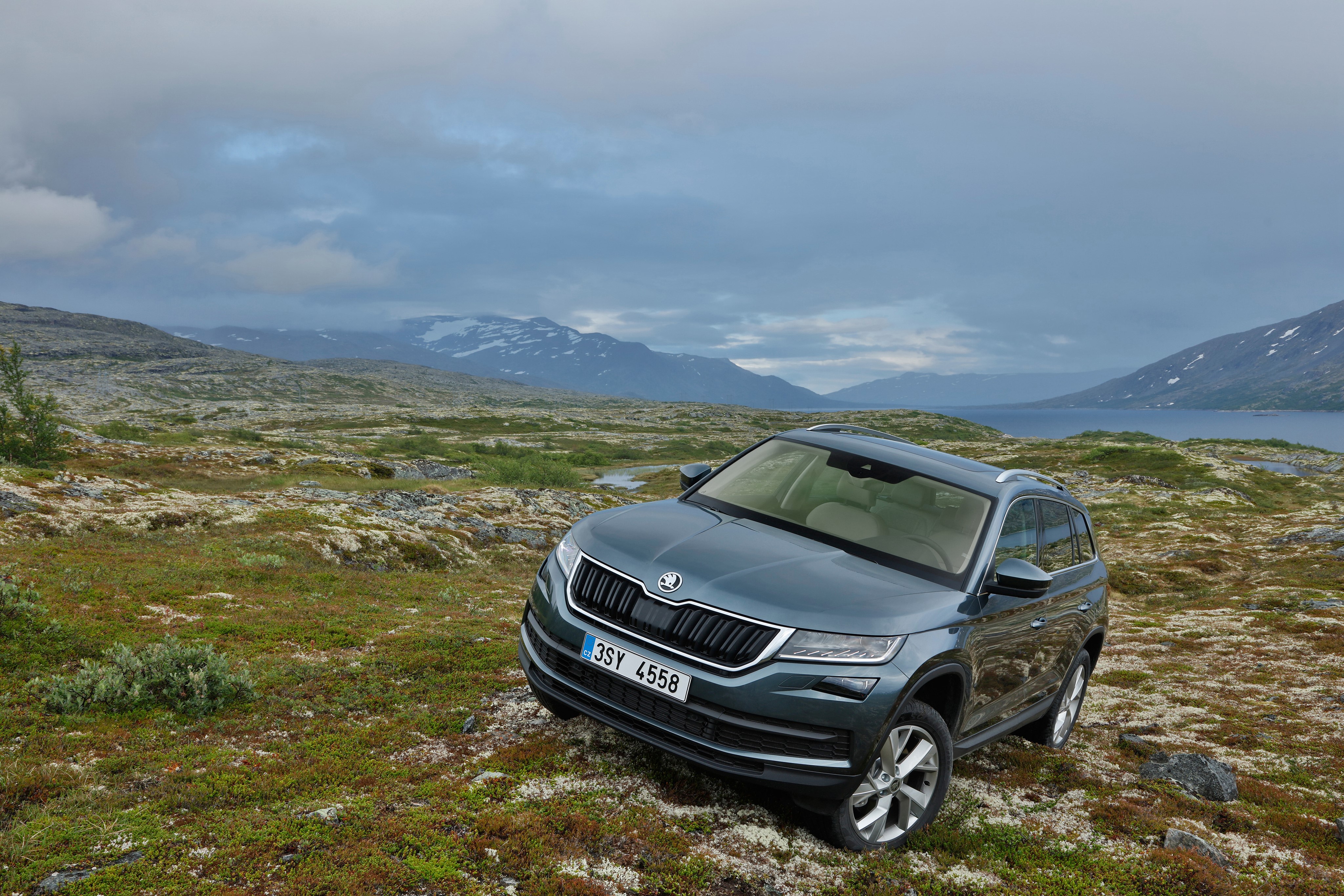 Skoda Kodiaq SUV in a rocky, mountainous landscape HD Wallpaper