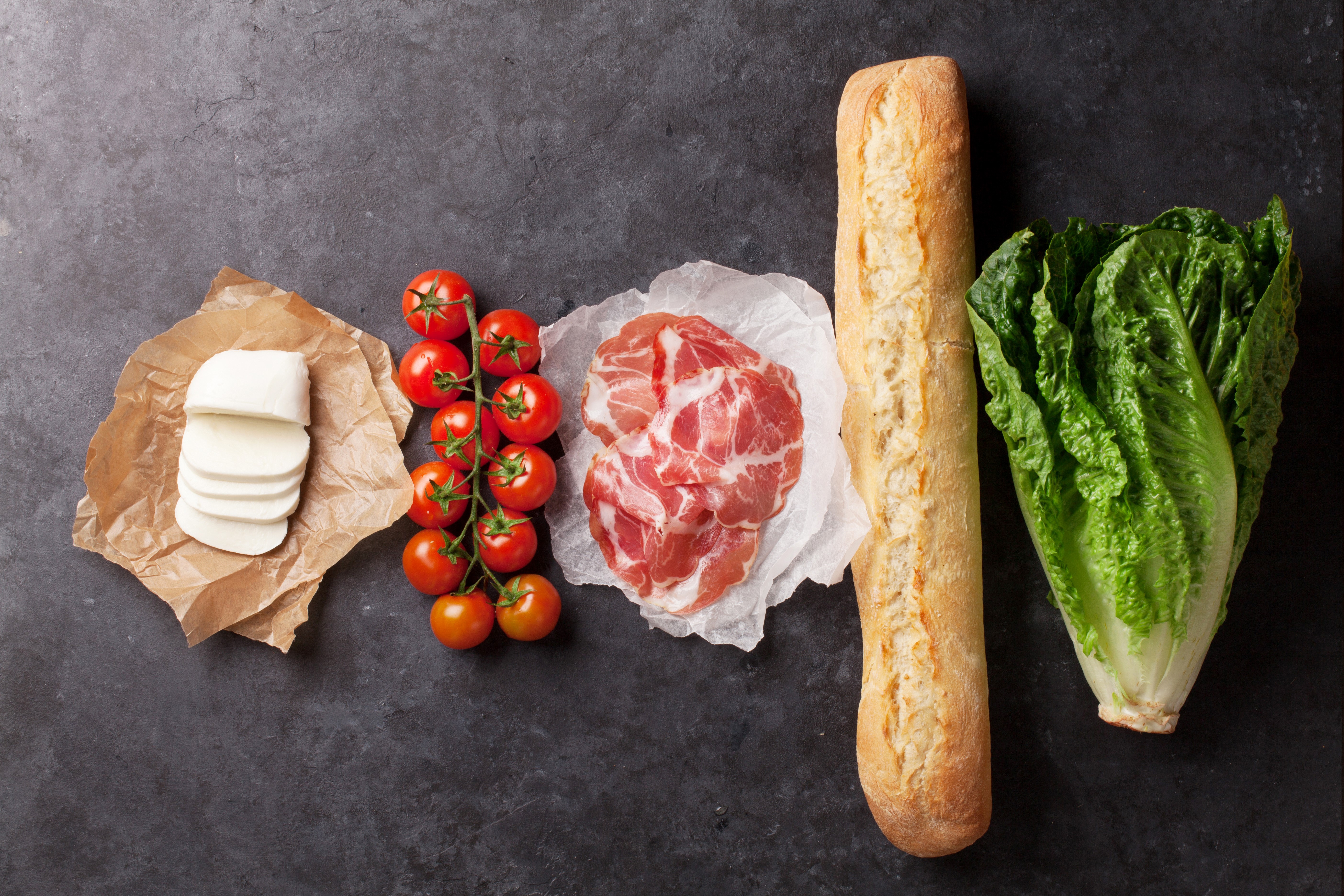 Ingredients for a sandwich: bread, cheese, ham, tomatoes, lettuce HD Wallpaper