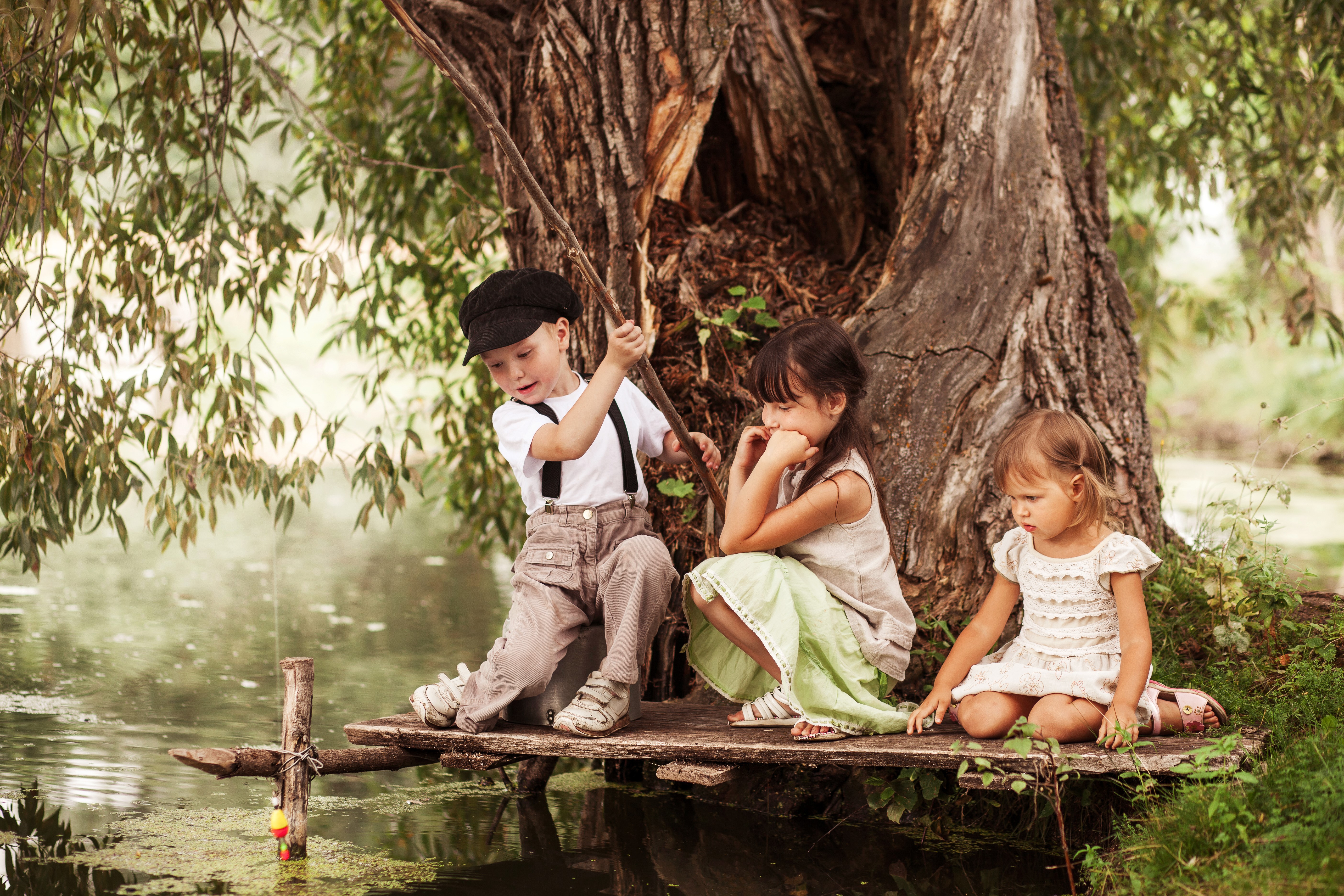 Three Children Fishing by a Large Tree HD Wallpaper