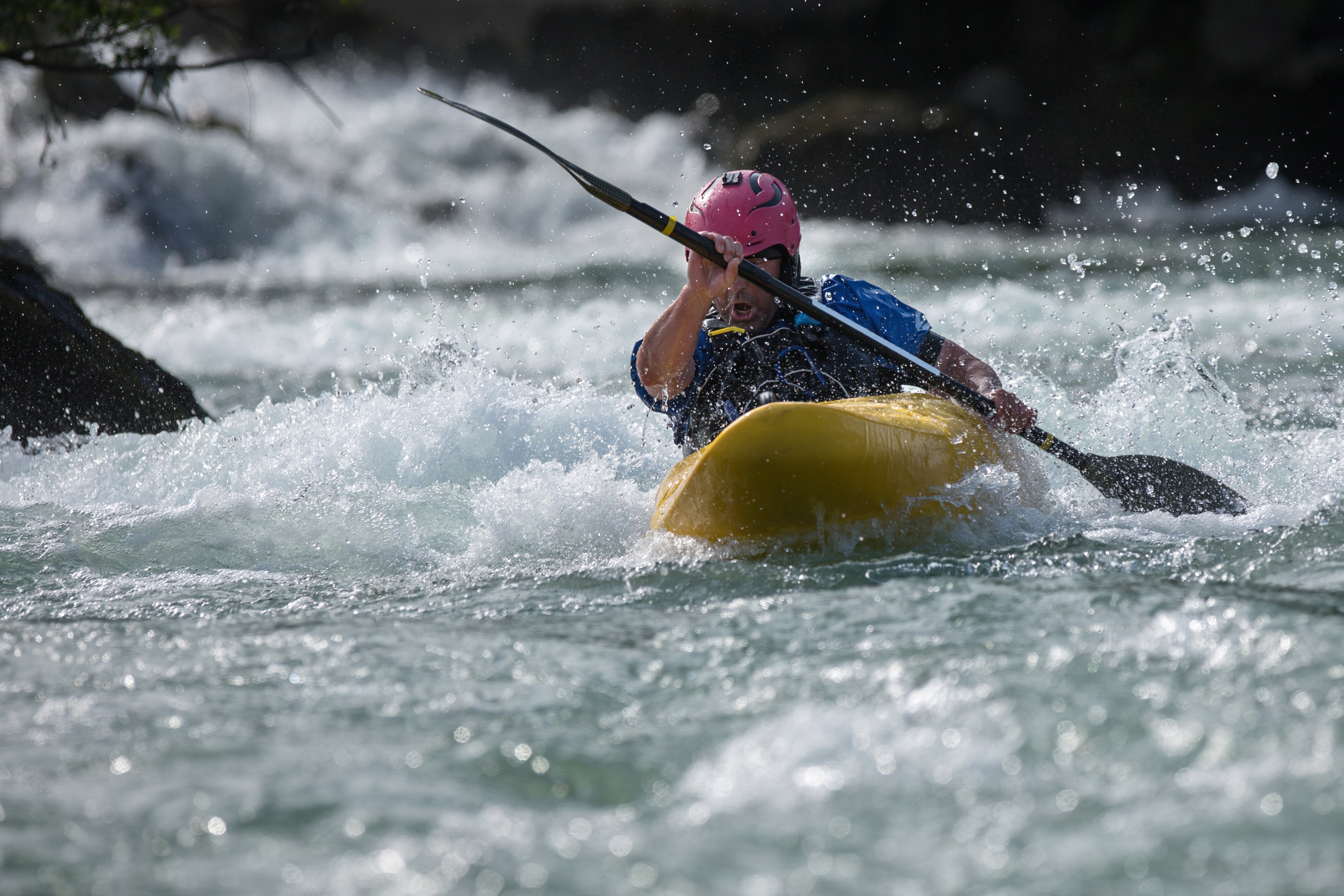 Man kayaking down a river HD Wallpaper