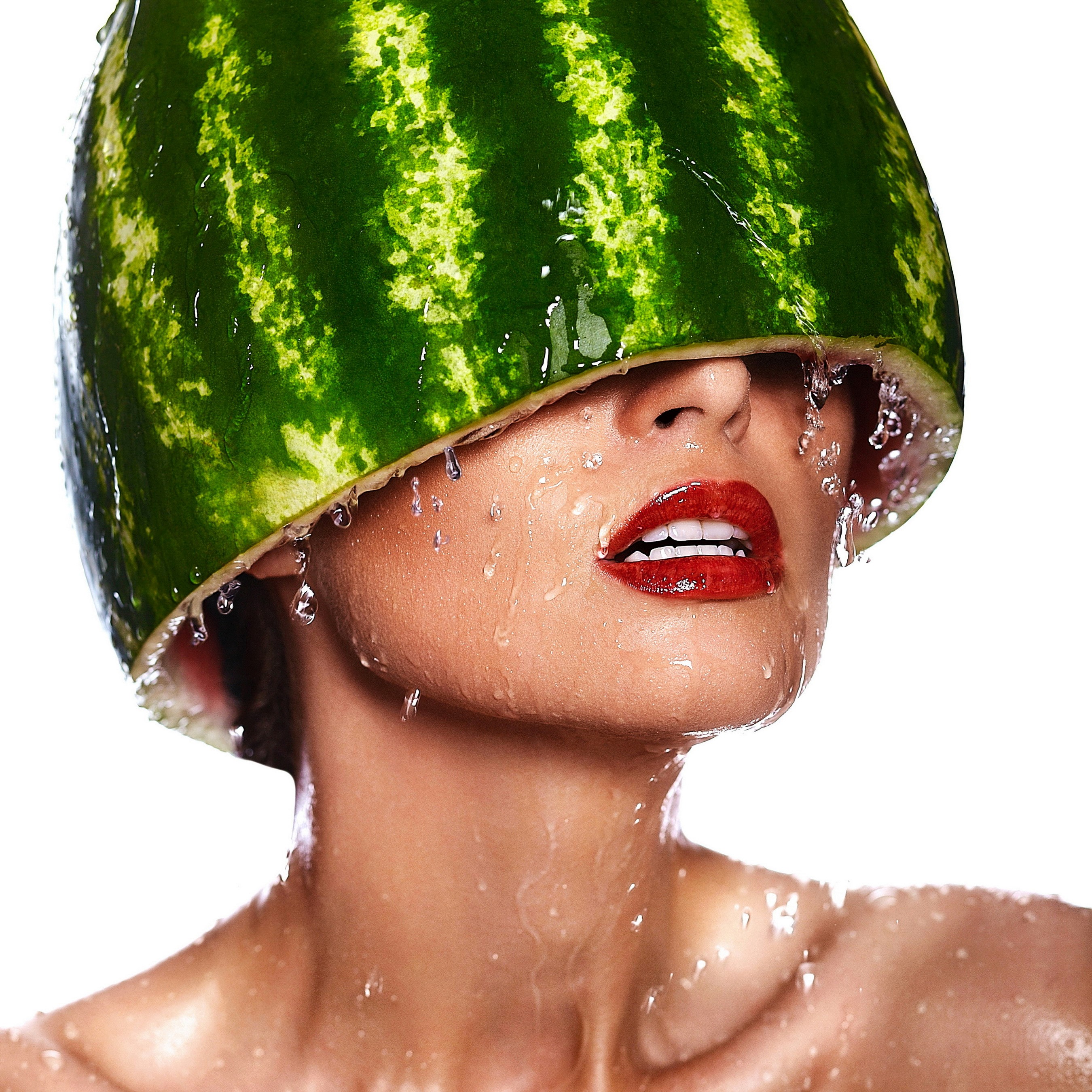 Woman with watermelon on head and water drops HD Wallpaper
