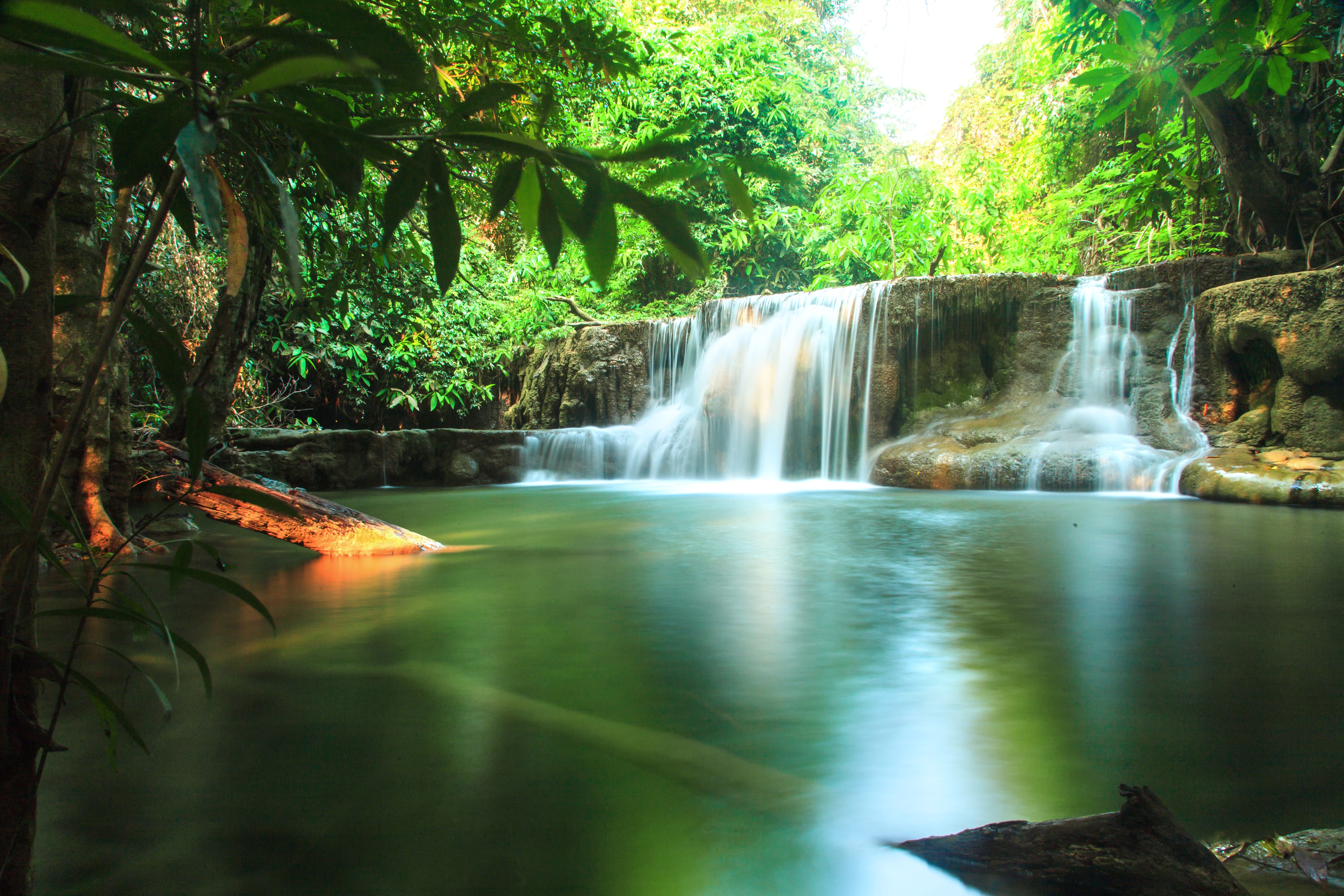 Waterfall in a lush green forest in Thailand HD Wallpaper