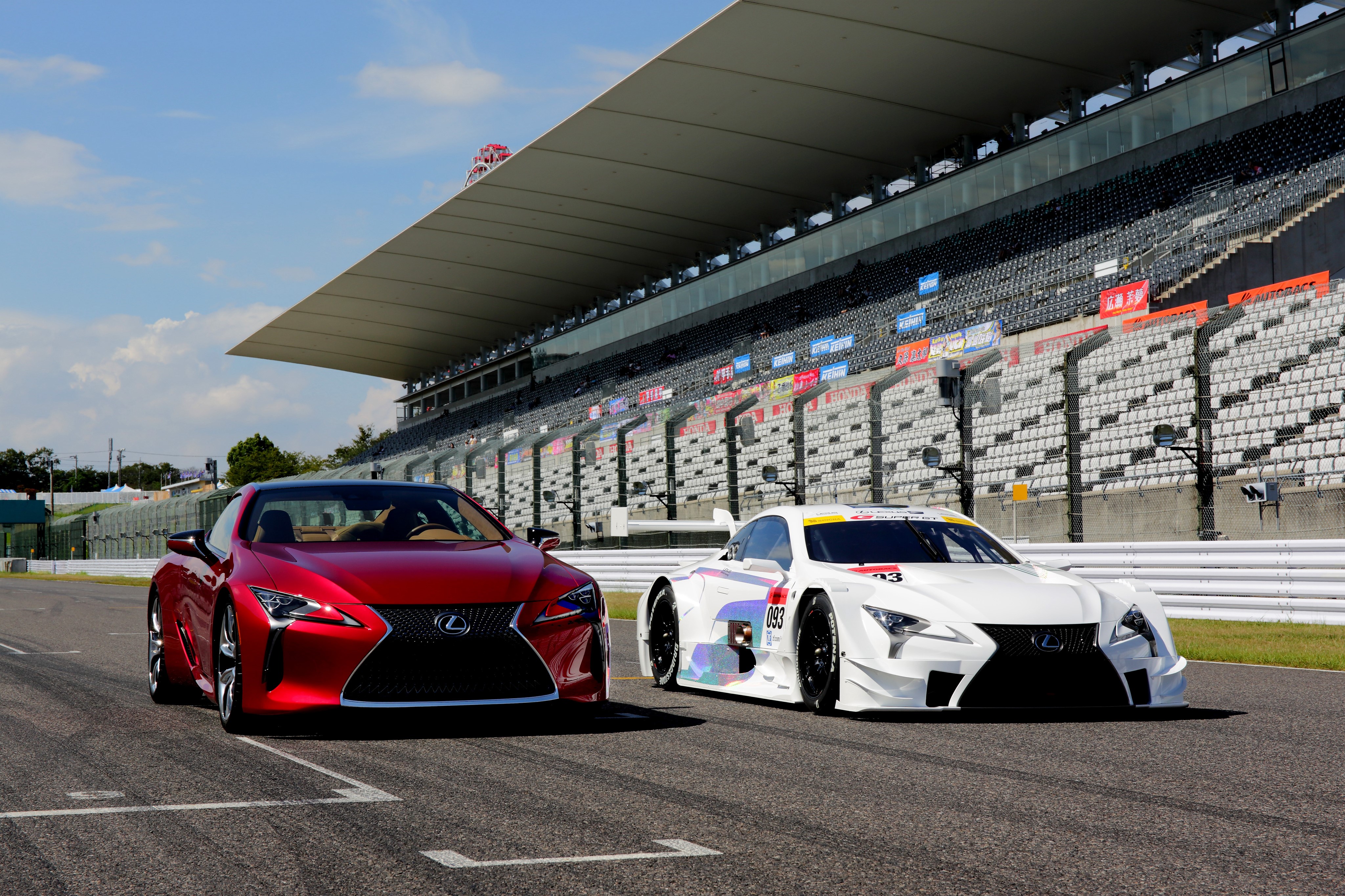 Two Lexus LC cars on a racetrack HD Wallpaper