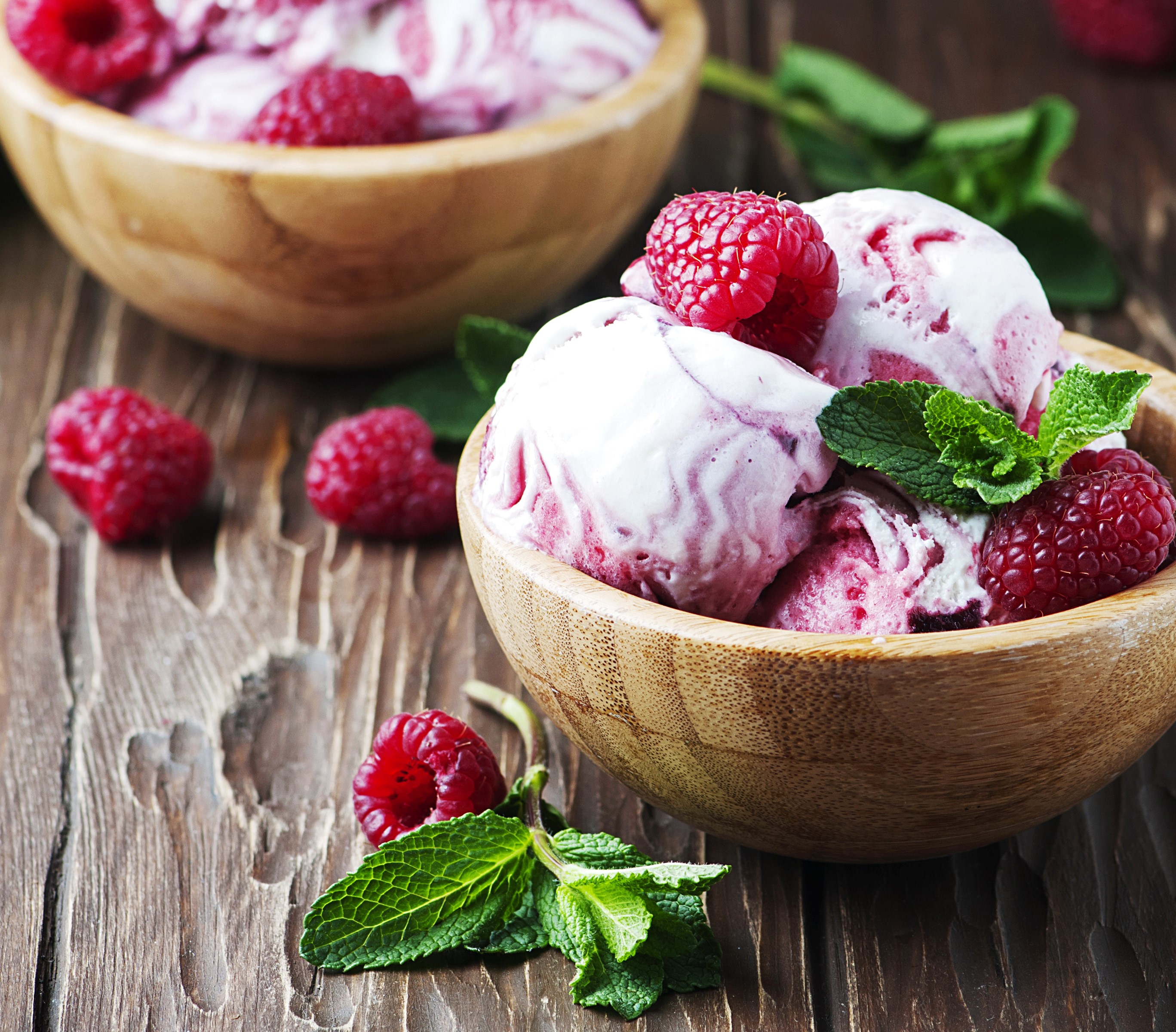Raspberry ice cream in wooden bowls with fresh raspberries and mint HD Wallpaper