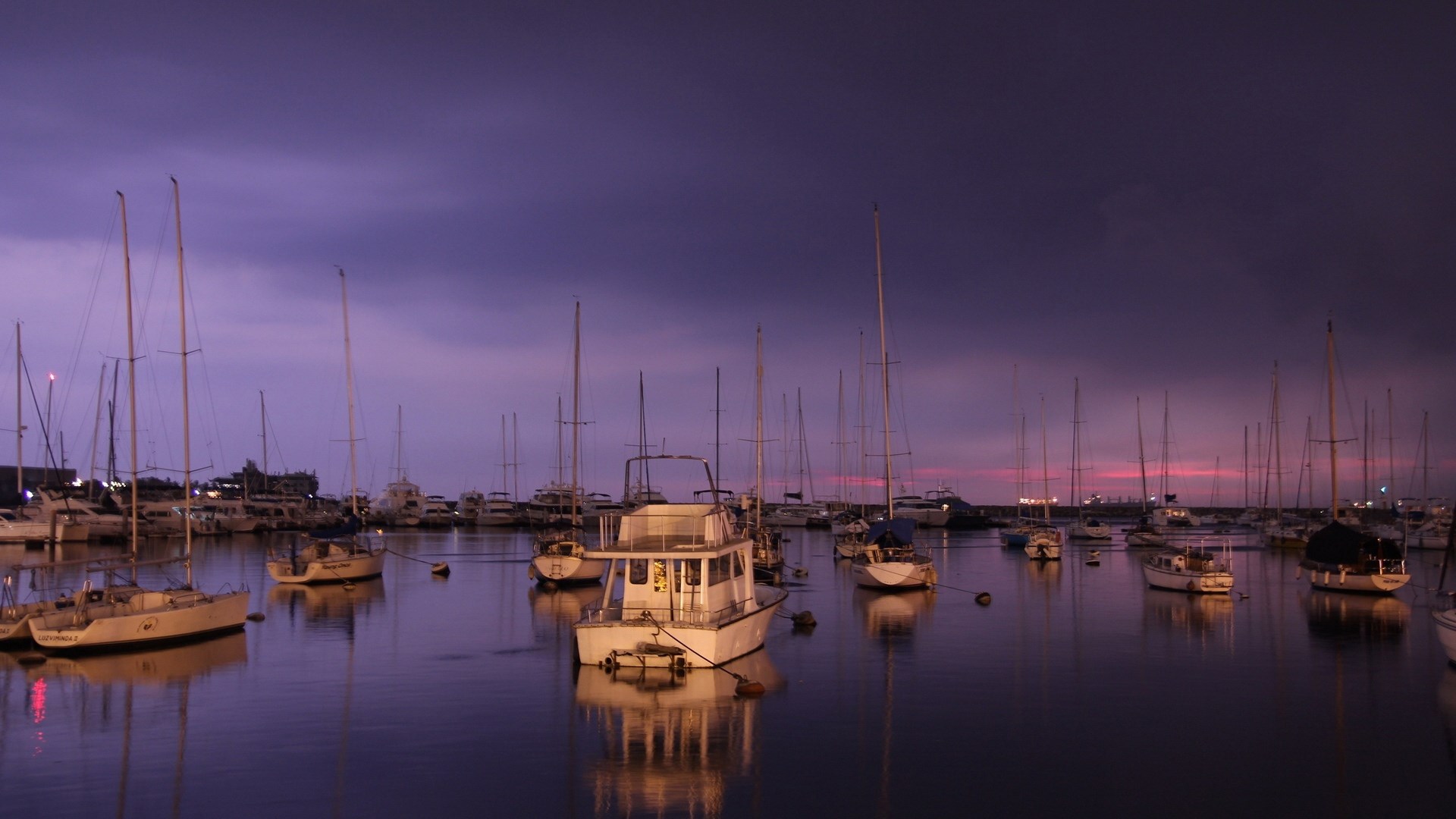 Boats docked in a harbor at dusk HD Wallpaper