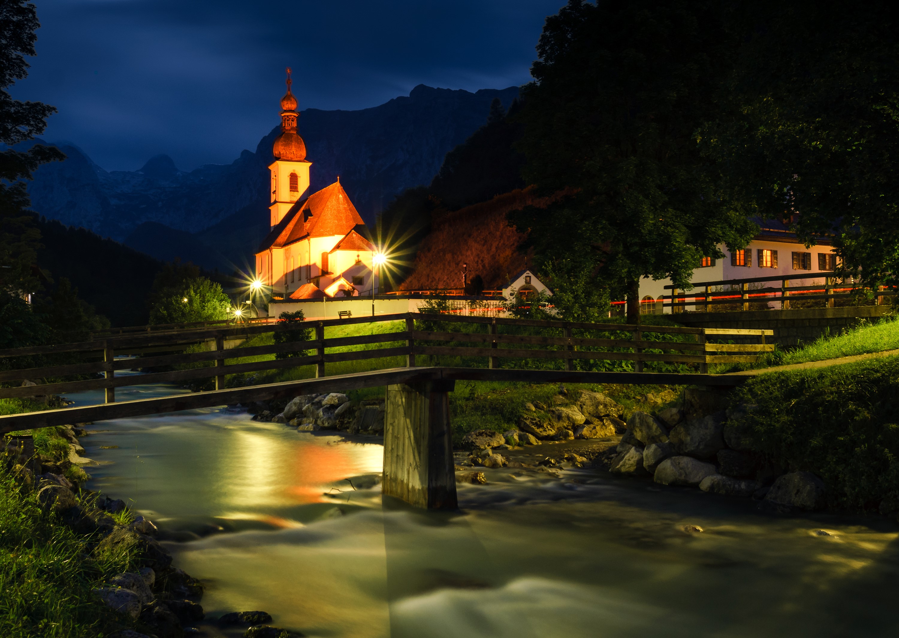 Church and bridge over river at night in Germany HD Wallpaper