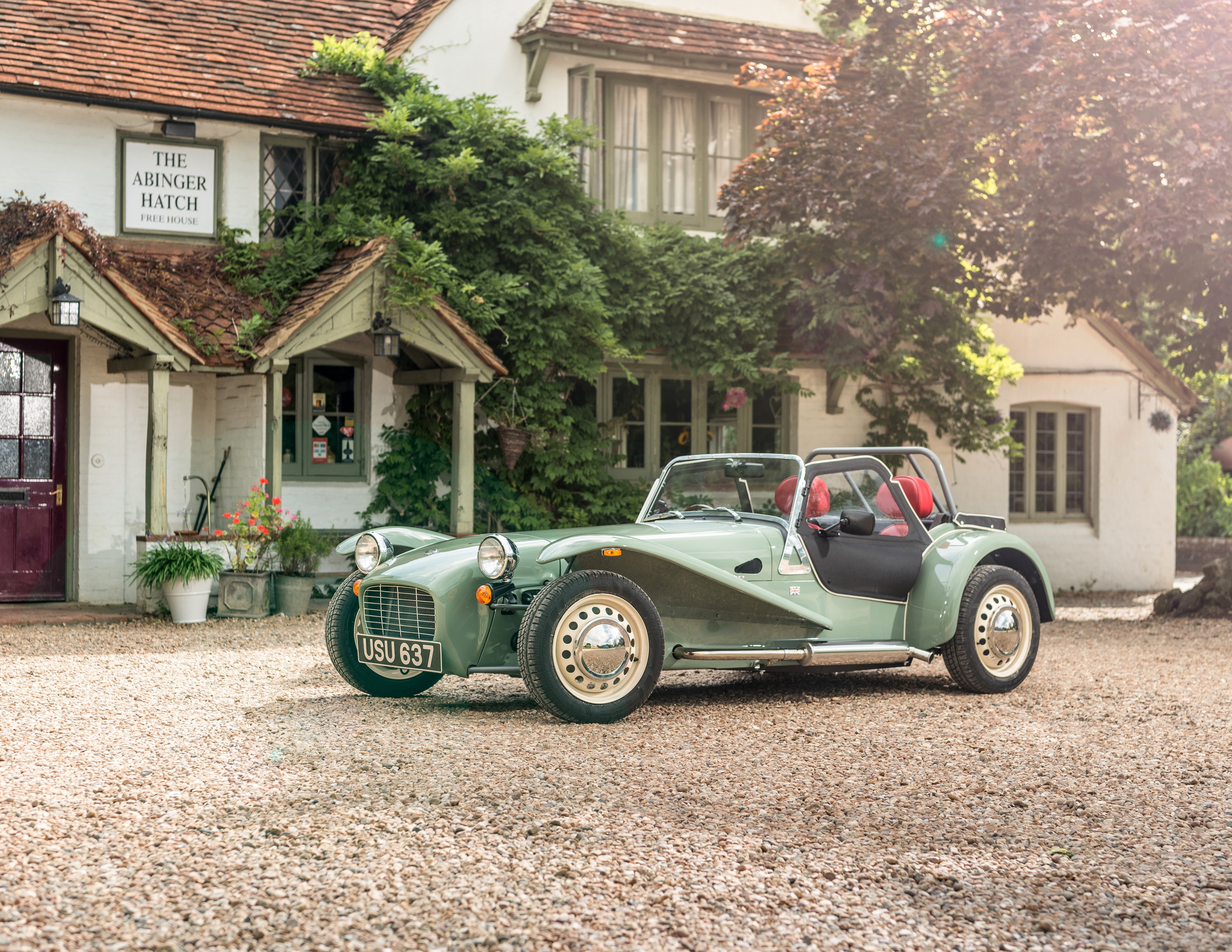 Green Caterham 7 car at The Abinger Hatch pub HD Wallpaper