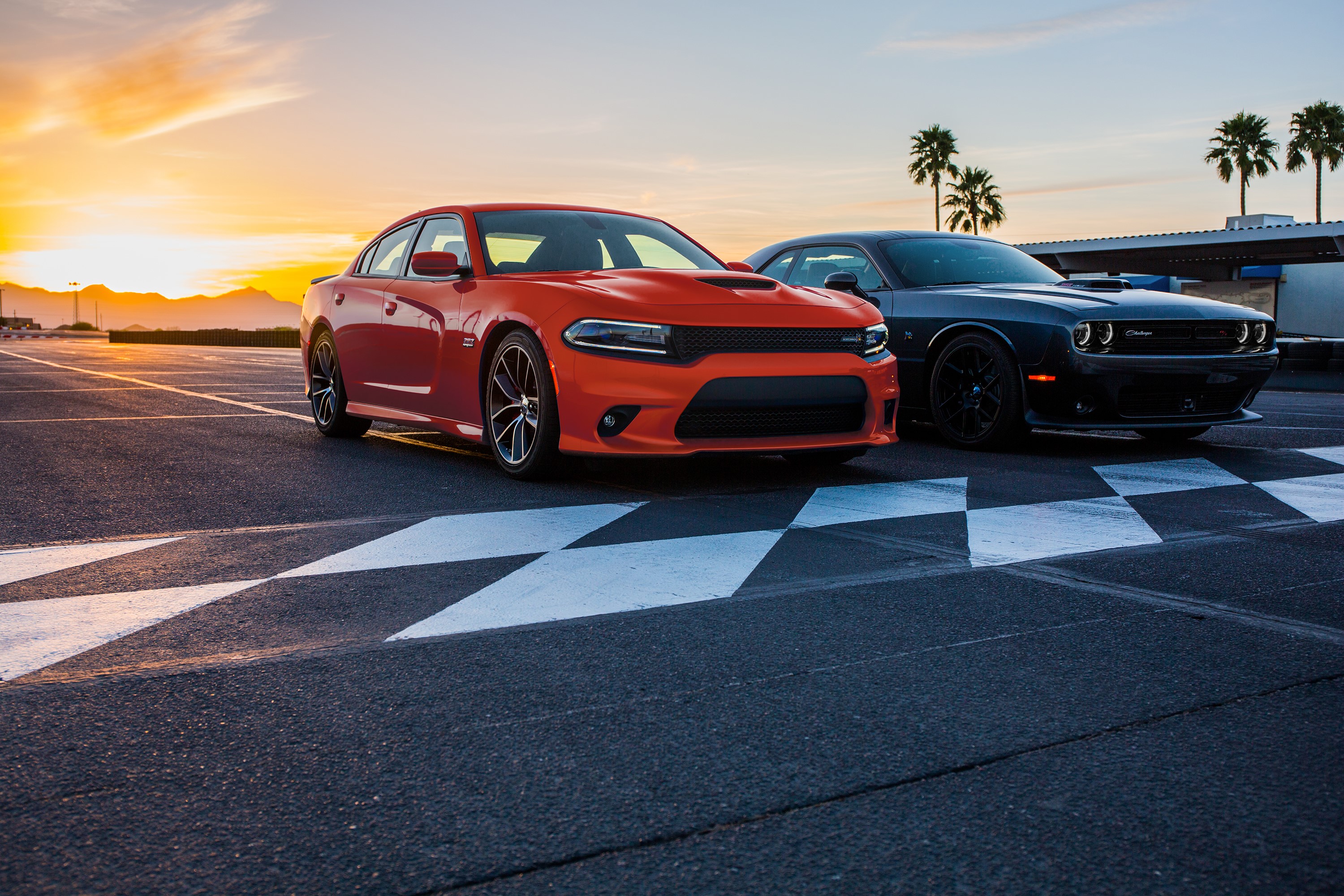 Orange Dodge Charger and Gray Dodge Challenger on Track HD Wallpaper