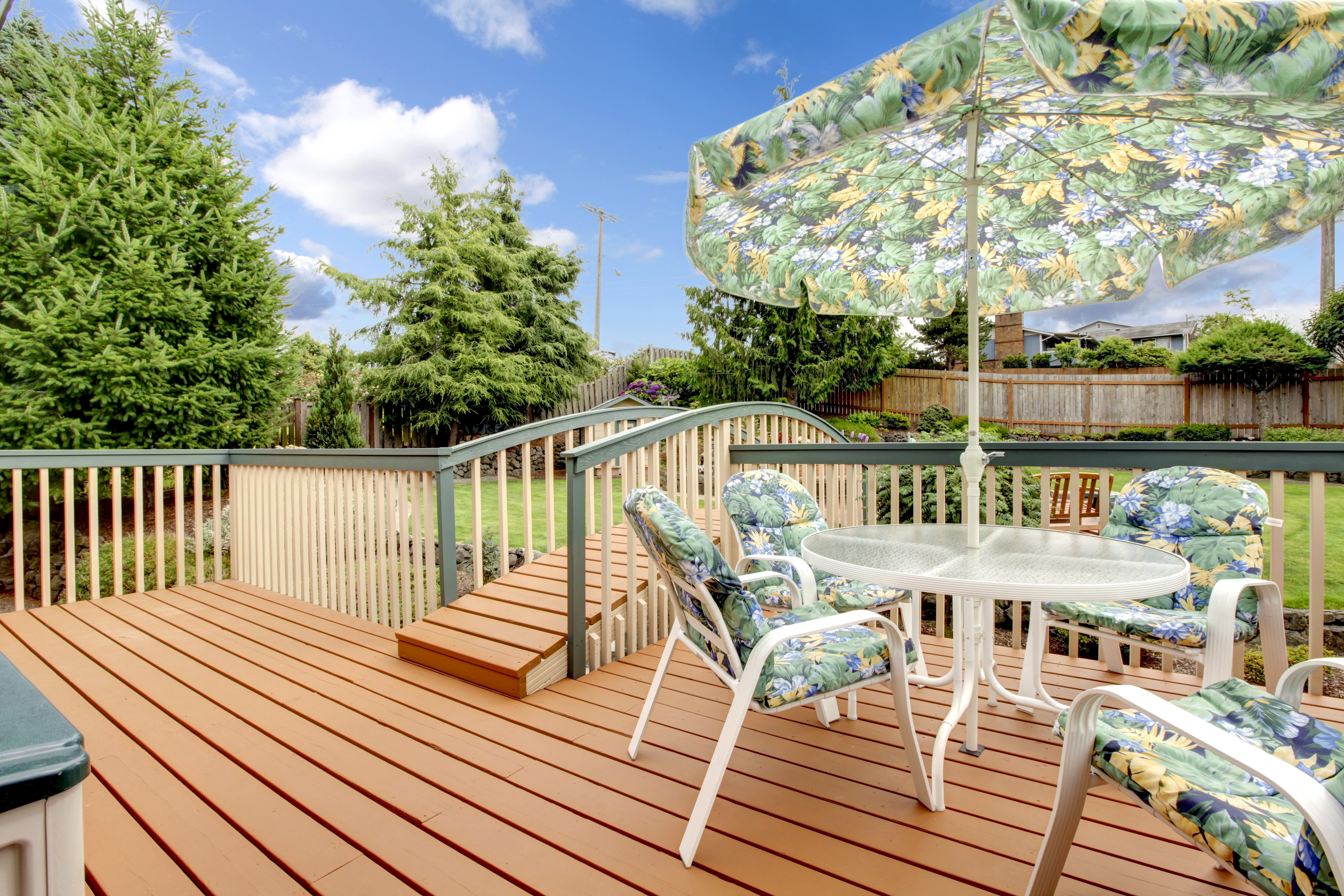 Deck with table, chairs, and umbrella HD Wallpaper