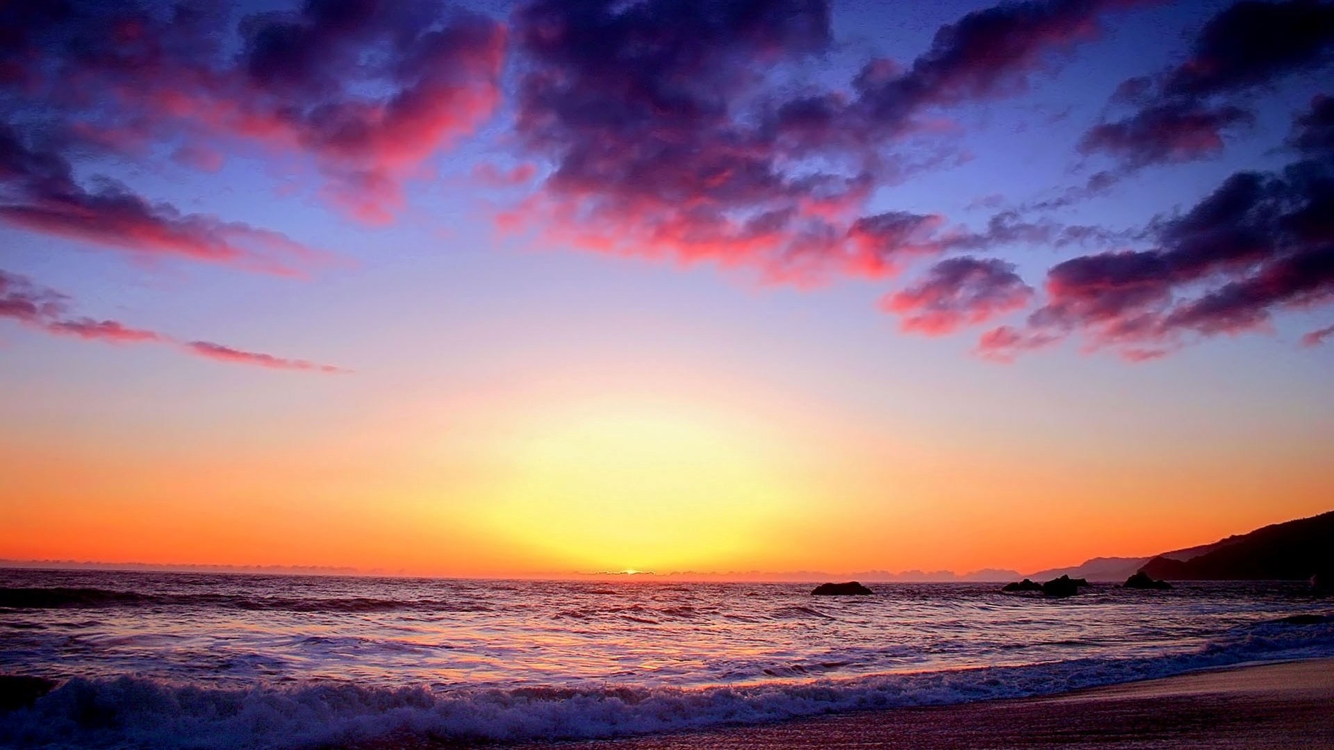 Sunset over the ocean with colorful clouds HD Wallpaper