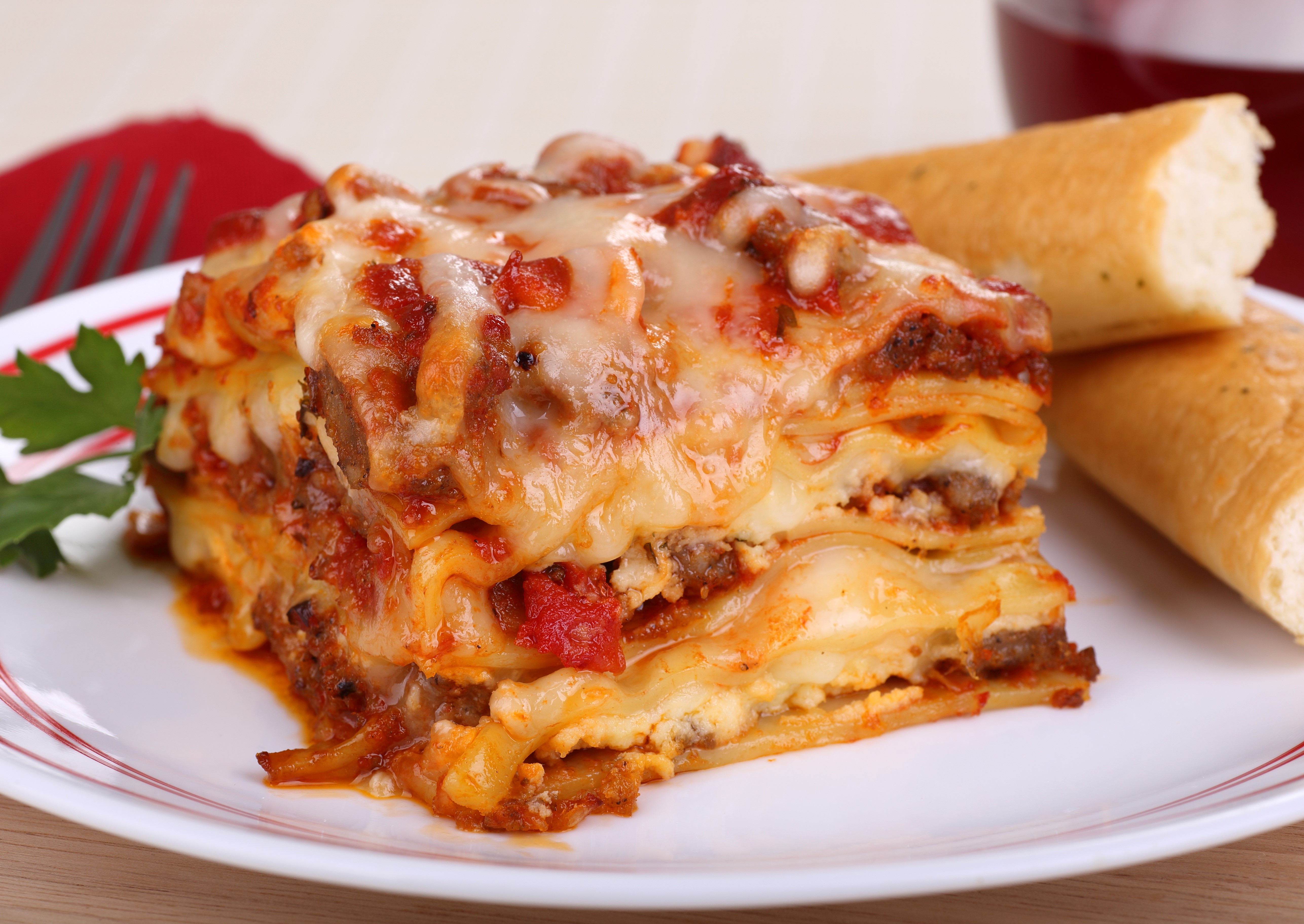 Lasagne with breadsticks and parsley HD Wallpaper